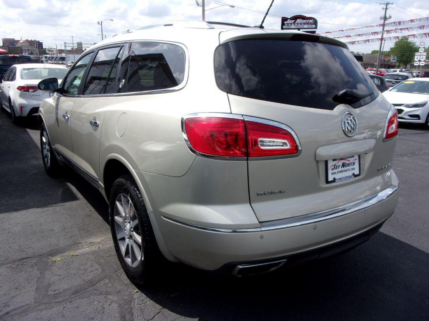 2013 GOLD BUICK ENCLAVE LEATHER GROUP (5GAKRCKD4DJ) with an 3.6L engine, Automatic transmission, located at 501 E. Columbia St., Springfield, OH, 45503, (800) 262-7122, 39.925262, -83.801796 - ***Leather Group***Dual Moonroof***3rd Row Seating***Heated Leather Seating***Rear Captian Chairs***Power Lift Gate***Serviced and Detailed*** - Photo#5