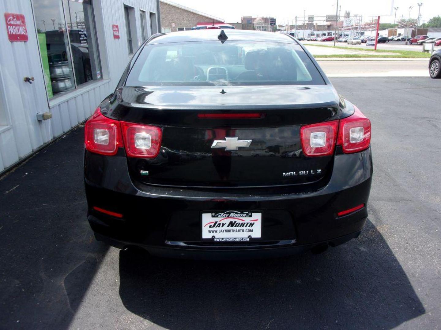 2014 BLACK CHEVROLET MALIBU LTZ (1G11H5SL3EF) with an 2.5L engine, Automatic transmission, located at 501 E. Columbia St., Springfield, OH, 45503, (800) 262-7122, 39.925262, -83.801796 - ***NEW TIRES***LTZ***Heated Leather Seating***Remote Start***Serviced and Detailed*** Jay North Auto has offered hand picked vehicles since 1965! Our customer's enjoy a NO pressure buying experience with a small town feel. All of our vehicles get fully inspected and detailed. We are a preferred - Photo#4