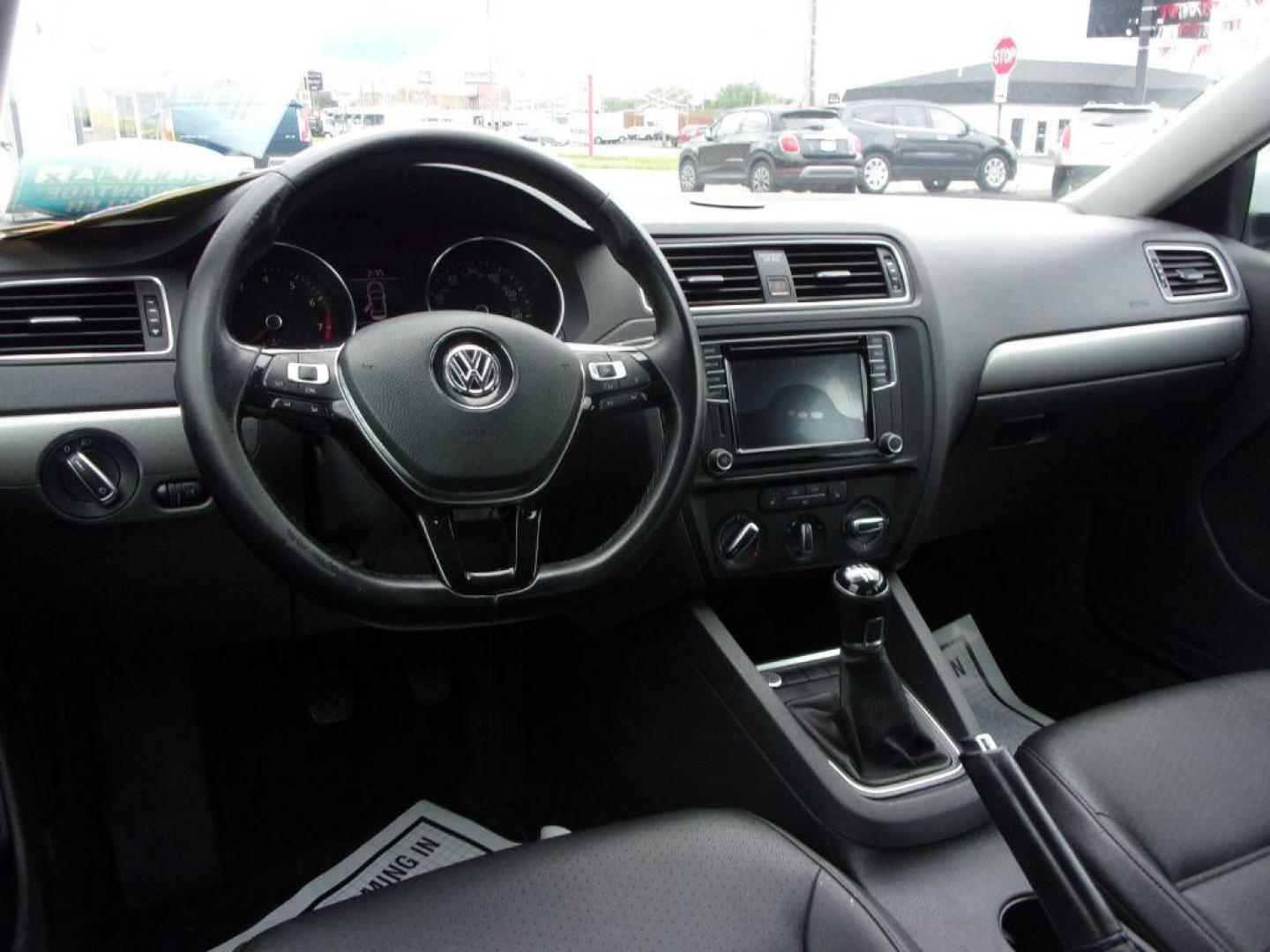 2017 WHITE VOLKSWAGEN JETTA SE (3VWB67AJ0HM) with an 1.4L engine, 5-Speed Manual transmission, located at 501 E. Columbia St., Springfield, OH, 45503, (800) 262-7122, 39.925262, -83.801796 - *** New Tires *** 5 Speed Manual *** SE *** Push Button Start *** Alloy Wheels *** Serviced and Detailed *** Moonroof *** Heated Leather Seating *** Back Up Camera *** Jay North Auto has offered hand picked vehicles since 1965! Our customer's enjoy a NO pressure buying experience with a small to - Photo#13