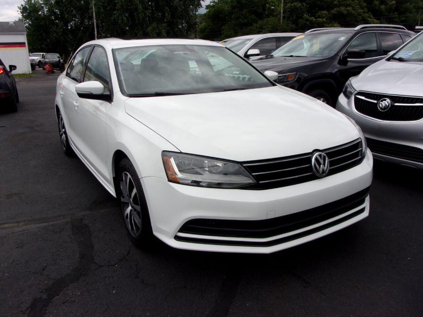 2017 WHITE VOLKSWAGEN JETTA SE (3VWB67AJ0HM) with an 1.4L engine, 5-Speed Manual transmission, located at 501 E. Columbia St., Springfield, OH, 45503, (800) 262-7122, 39.925262, -83.801796 - *** New Tires *** 5 Speed Manual *** SE *** Push Button Start *** Alloy Wheels *** Serviced and Detailed *** Moonroof *** Heated Leather Seating *** Back Up Camera *** Jay North Auto has offered hand picked vehicles since 1965! Our customer's enjoy a NO pressure buying experience with a small to - Photo#2