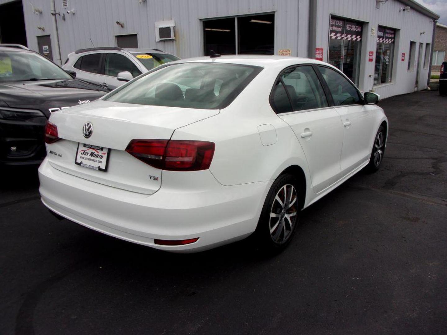 2017 WHITE VOLKSWAGEN JETTA SE (3VWB67AJ0HM) with an 1.4L engine, 5-Speed Manual transmission, located at 501 E. Columbia St., Springfield, OH, 45503, (800) 262-7122, 39.925262, -83.801796 - Photo#3