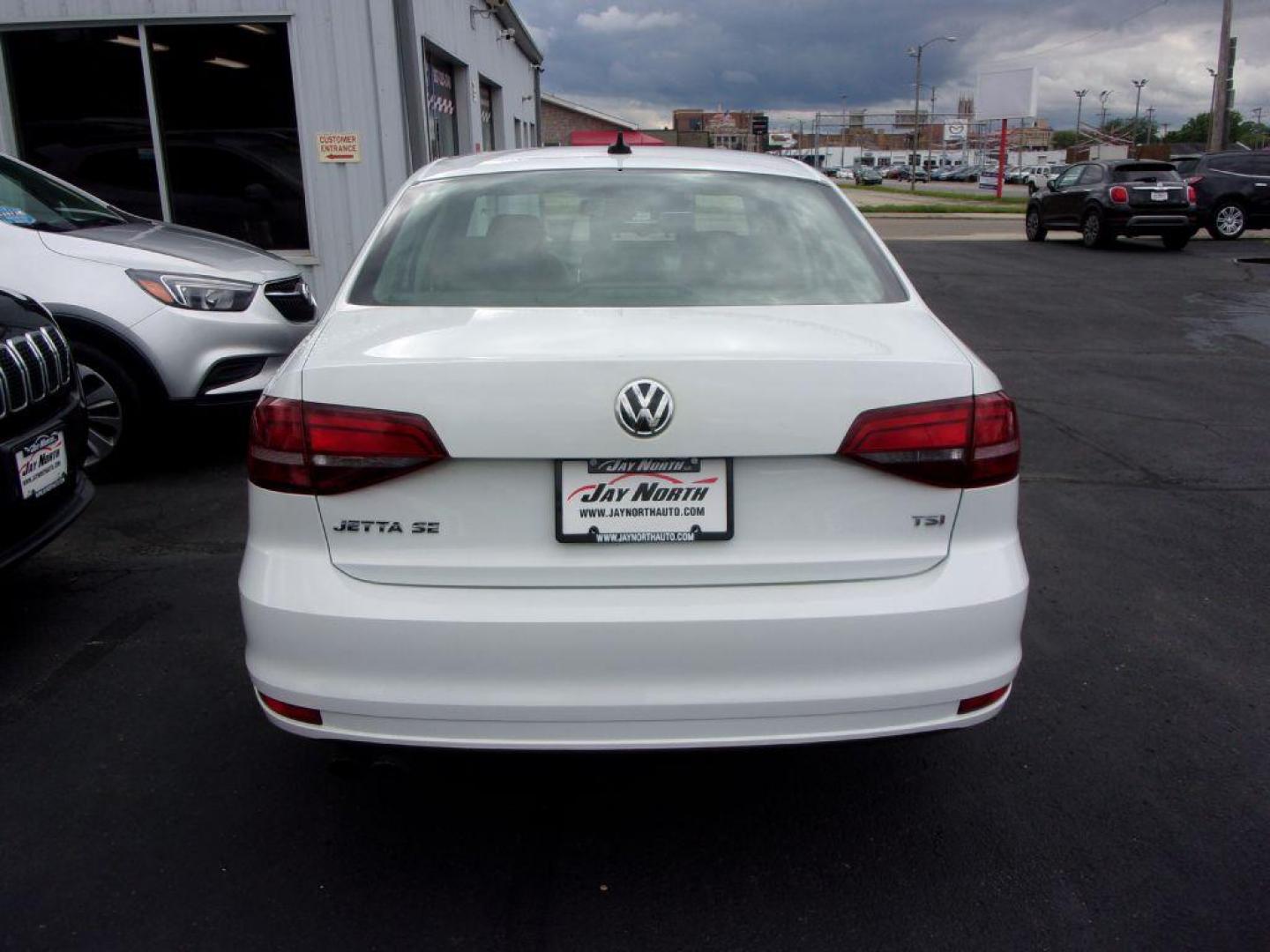 2017 WHITE VOLKSWAGEN JETTA SE (3VWB67AJ0HM) with an 1.4L engine, 5-Speed Manual transmission, located at 501 E. Columbia St., Springfield, OH, 45503, (800) 262-7122, 39.925262, -83.801796 - Photo#4