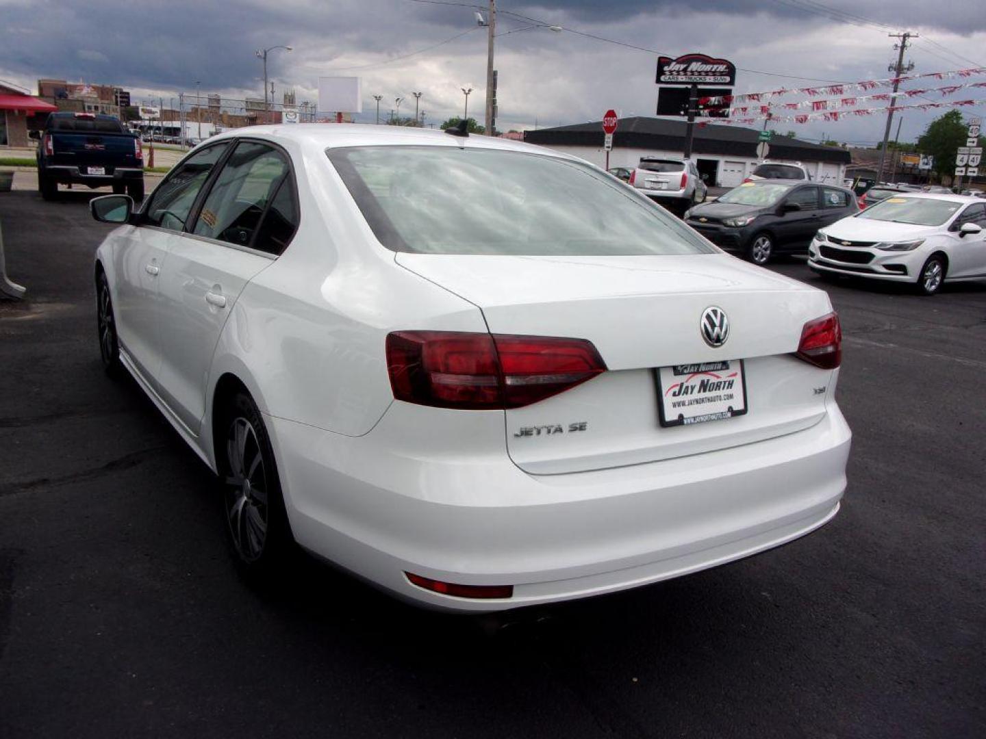 2017 WHITE VOLKSWAGEN JETTA SE (3VWB67AJ0HM) with an 1.4L engine, 5-Speed Manual transmission, located at 501 E. Columbia St., Springfield, OH, 45503, (800) 262-7122, 39.925262, -83.801796 - Photo#5