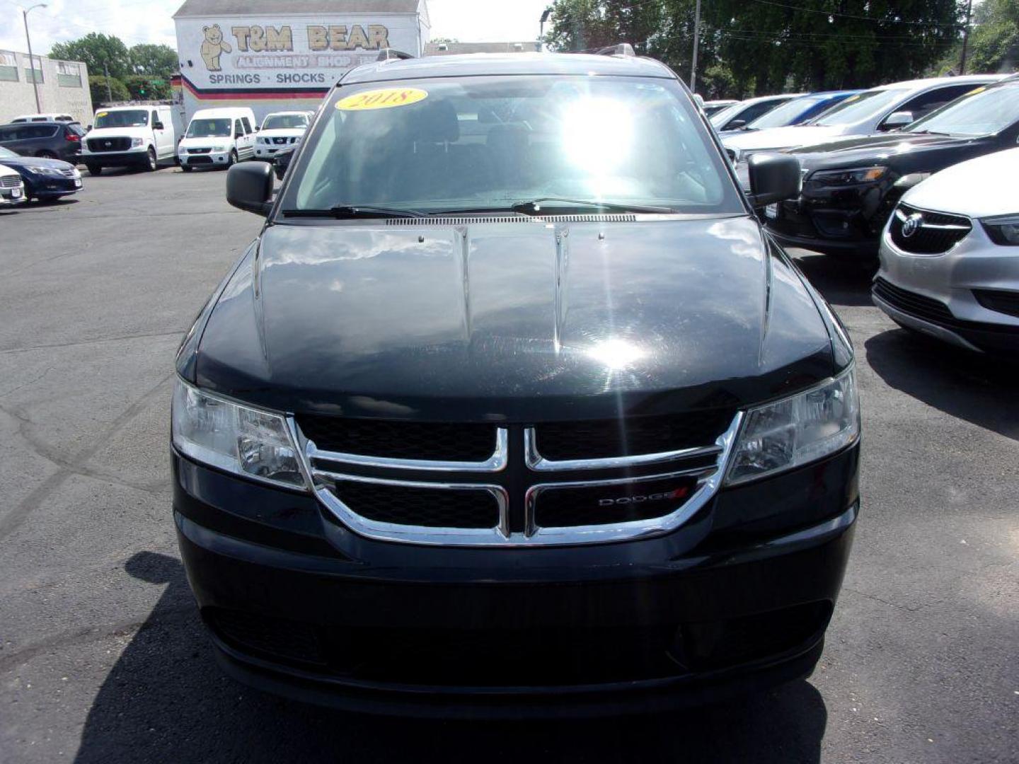 2018 BLACK DODGE JOURNEY SE (3C4PDCAB4JT) with an 2.4L engine, Automatic transmission, located at 501 E. Columbia St., Springfield, OH, 45503, (800) 262-7122, 39.925262, -83.801796 - *** New Tires *** Serviced and Detailed *** 3rd Row Seating *** FWD *** Back Up Camera *** Jay North Auto has offered hand picked vehicles since 1965! Our customer's enjoy a NO pressure buying experience with a small town feel. All of our vehicles get fully inspected and detailed. We are a pref - Photo#1