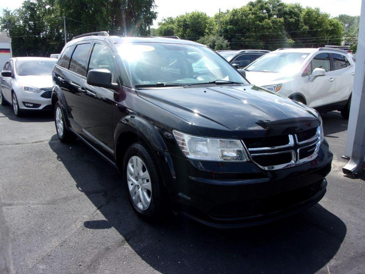 2018 BLACK DODGE JOURNEY SE (3C4PDCAB4JT) with an 2.4L engine, Automatic transmission, located at 501 E. Columbia St., Springfield, OH, 45503, (800) 262-7122, 39.925262, -83.801796 - *** New Tires *** Serviced and Detailed *** 3rd Row Seating *** FWD *** Back Up Camera *** Jay North Auto has offered hand picked vehicles since 1965! Our customer's enjoy a NO pressure buying experience with a small town feel. All of our vehicles get fully inspected and detailed. We are a pref - Photo#2