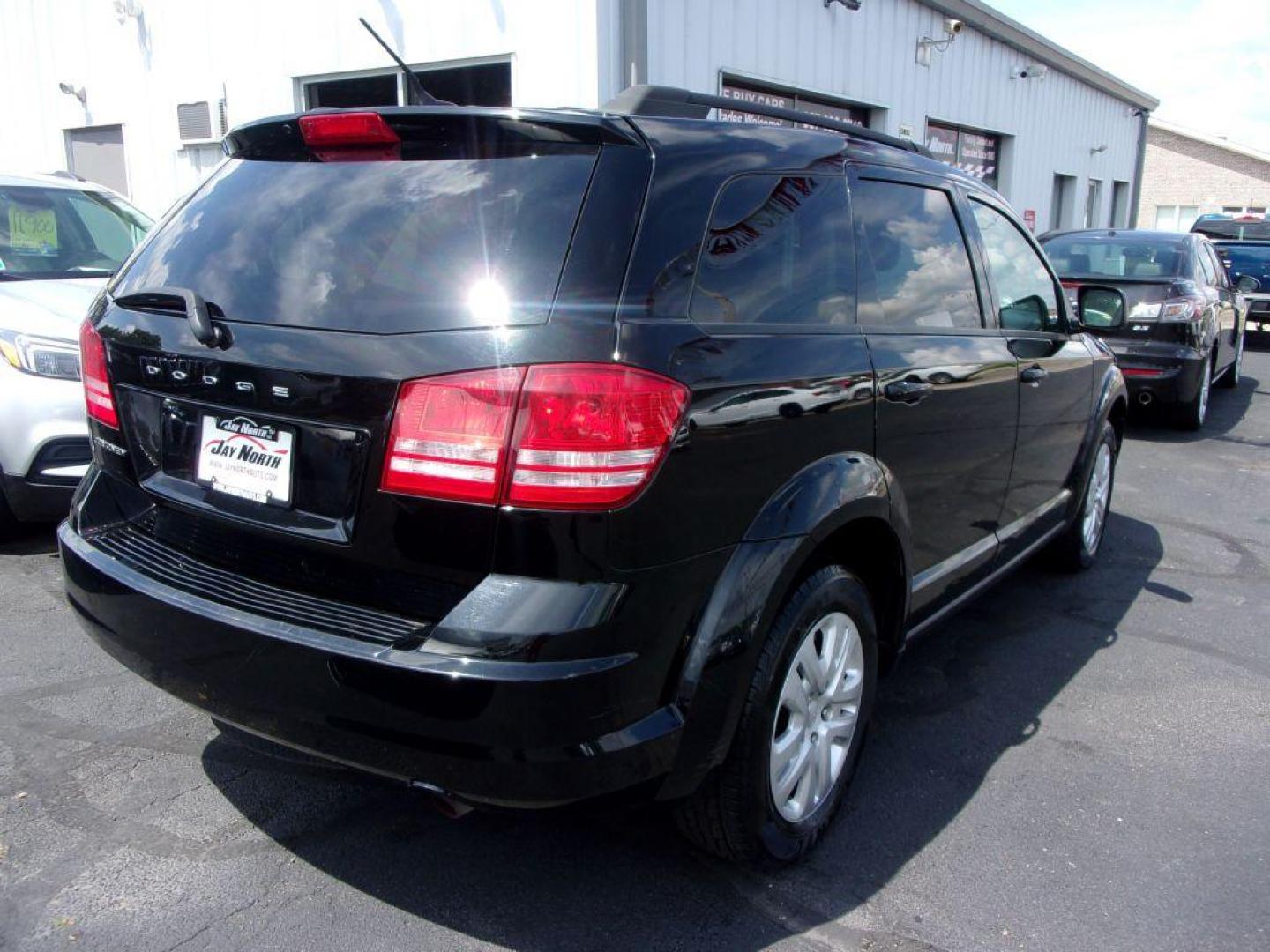 2018 BLACK DODGE JOURNEY SE (3C4PDCAB4JT) with an 2.4L engine, Automatic transmission, located at 501 E. Columbia St., Springfield, OH, 45503, (800) 262-7122, 39.925262, -83.801796 - *** New Tires *** Serviced and Detailed *** 3rd Row Seating *** FWD *** Back Up Camera *** Jay North Auto has offered hand picked vehicles since 1965! Our customer's enjoy a NO pressure buying experience with a small town feel. All of our vehicles get fully inspected and detailed. We are a pref - Photo#3