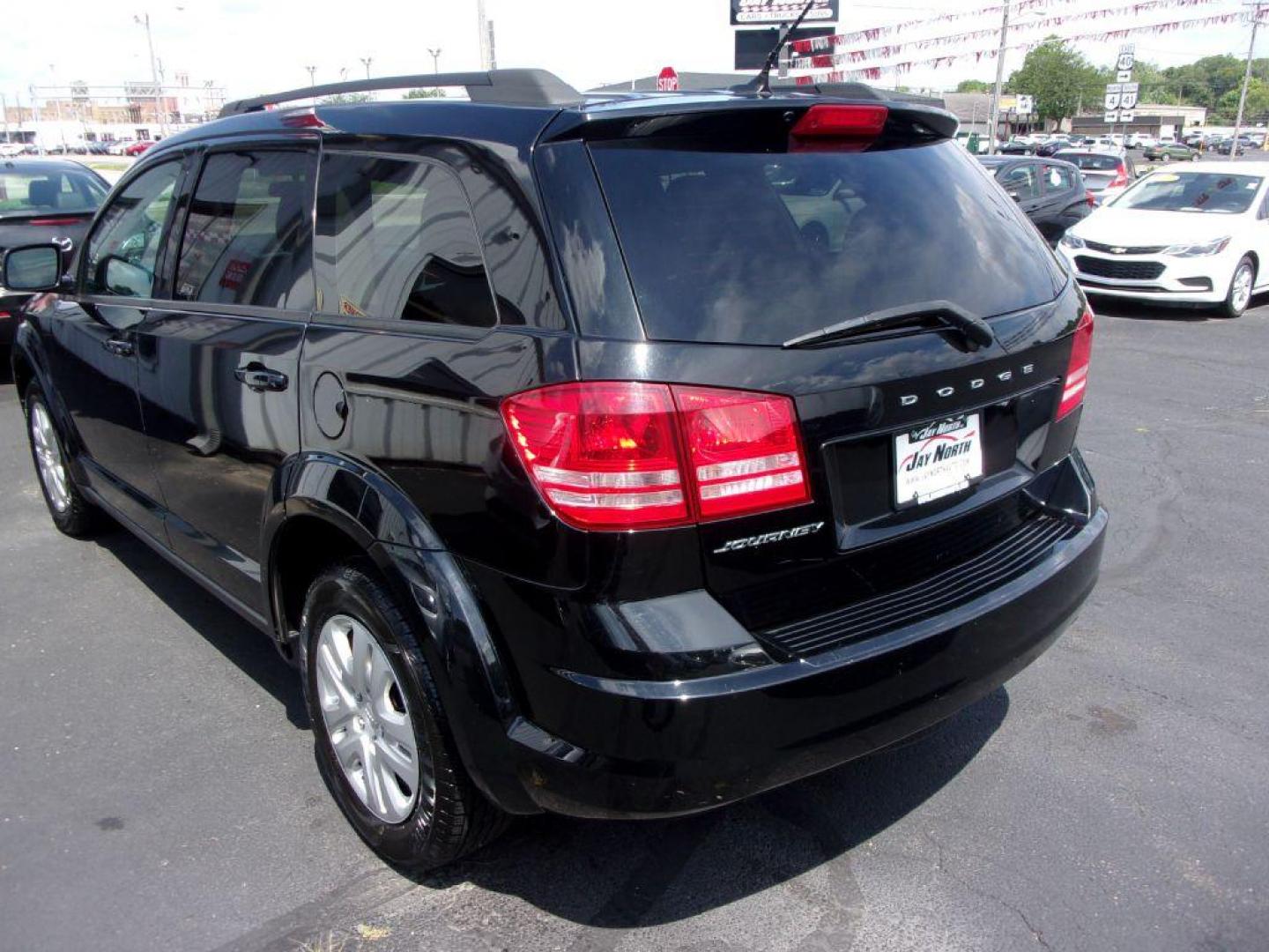 2018 BLACK DODGE JOURNEY SE (3C4PDCAB4JT) with an 2.4L engine, Automatic transmission, located at 501 E. Columbia St., Springfield, OH, 45503, (800) 262-7122, 39.925262, -83.801796 - *** New Tires *** Serviced and Detailed *** 3rd Row Seating *** FWD *** Back Up Camera *** Jay North Auto has offered hand picked vehicles since 1965! Our customer's enjoy a NO pressure buying experience with a small town feel. All of our vehicles get fully inspected and detailed. We are a pref - Photo#5