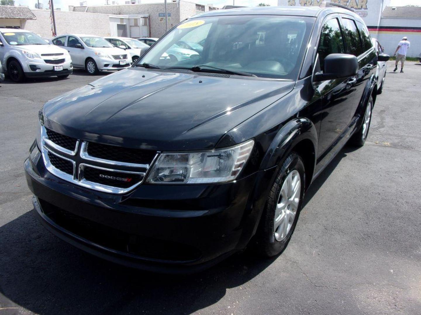 2018 BLACK DODGE JOURNEY SE (3C4PDCAB4JT) with an 2.4L engine, Automatic transmission, located at 501 E. Columbia St., Springfield, OH, 45503, (800) 262-7122, 39.925262, -83.801796 - *** New Tires *** Serviced and Detailed *** 3rd Row Seating *** FWD *** Back Up Camera *** Jay North Auto has offered hand picked vehicles since 1965! Our customer's enjoy a NO pressure buying experience with a small town feel. All of our vehicles get fully inspected and detailed. We are a pref - Photo#6