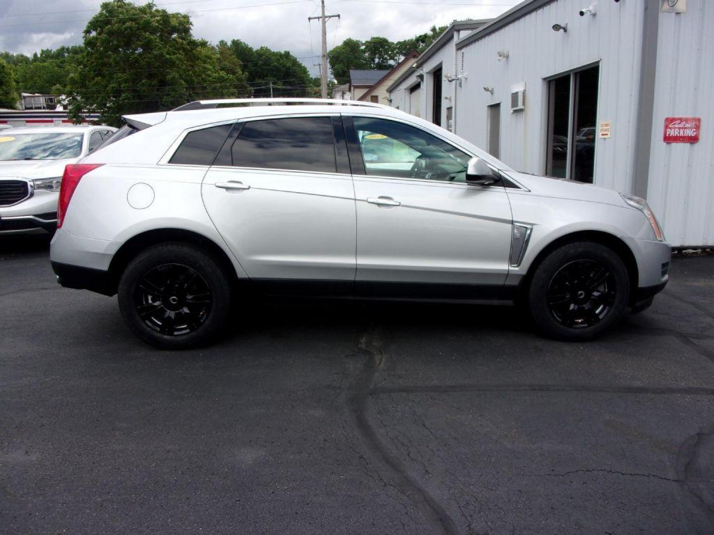 2016 SILVER CADILLAC SRX LUXURY COLLECTION (3GYFNBE33GS) with an 3.6L engine, Automatic transmission, located at 501 E. Columbia St., Springfield, OH, 45503, (800) 262-7122, 39.925262, -83.801796 - Photo#0