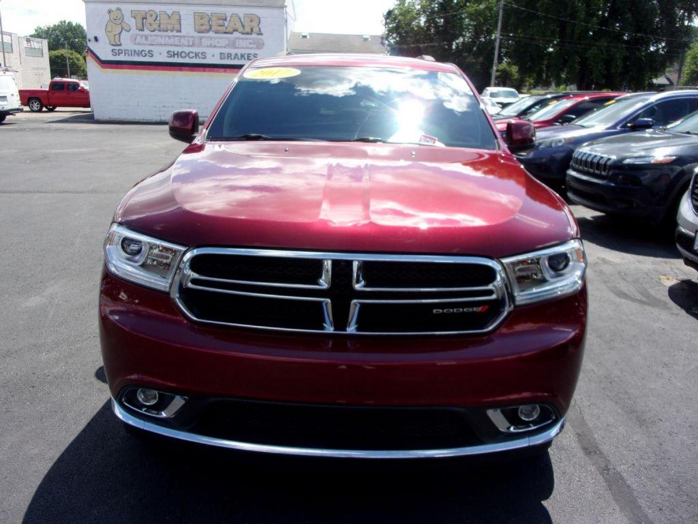 2017 RED DODGE DURANGO SXT (1C4RDJAG0HC) with an 3.6L engine, Automatic transmission, located at 501 E. Columbia St., Springfield, OH, 45503, (800) 262-7122, 39.925262, -83.801796 - *** Serviced and Detailed *** AWD V6 *** 3rd Row Seating *** SXT *** Customer Preferred Package 23B $2,200 Bright Side Roof Rails Comfort Seating Group Integrated Roof Rail Crossbars Leather-Wrapped Steering Wheel Power 4-Way Driver Lumbar Adjust Power 8-Way Driver Seat / Manual Passenger - Photo#2