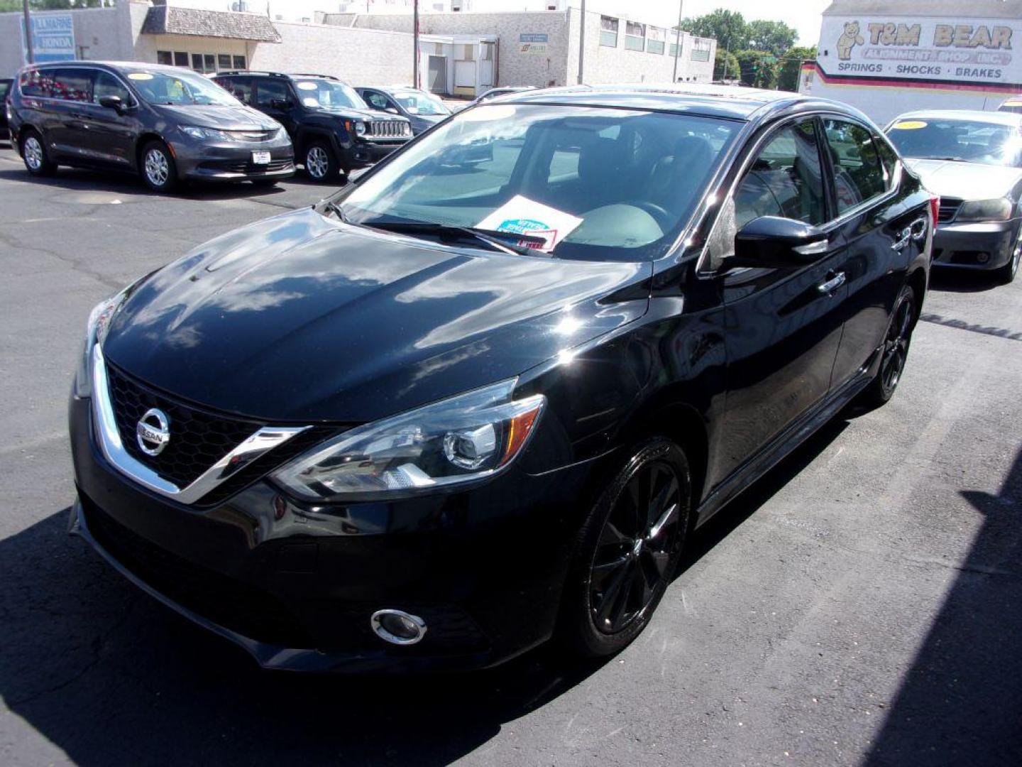 2017 BLACK NISSAN SENTRA SR TURBO (3N1CB7AP3HY) with an 1.6L engine, 6-Speed Manual transmission, located at 501 E. Columbia St., Springfield, OH, 45503, (800) 262-7122, 39.925262, -83.801796 - *** SR Turbo *** 6 Speed Manual *** Midnight Package *** Serviced and Detailed *** Jay North Auto has offered hand picked vehicles since 1965! Our customer's enjoy a NO pressure buying experience with a small town feel. All of our vehicles get fully inspected and detailed. We are a preferred de - Photo#3