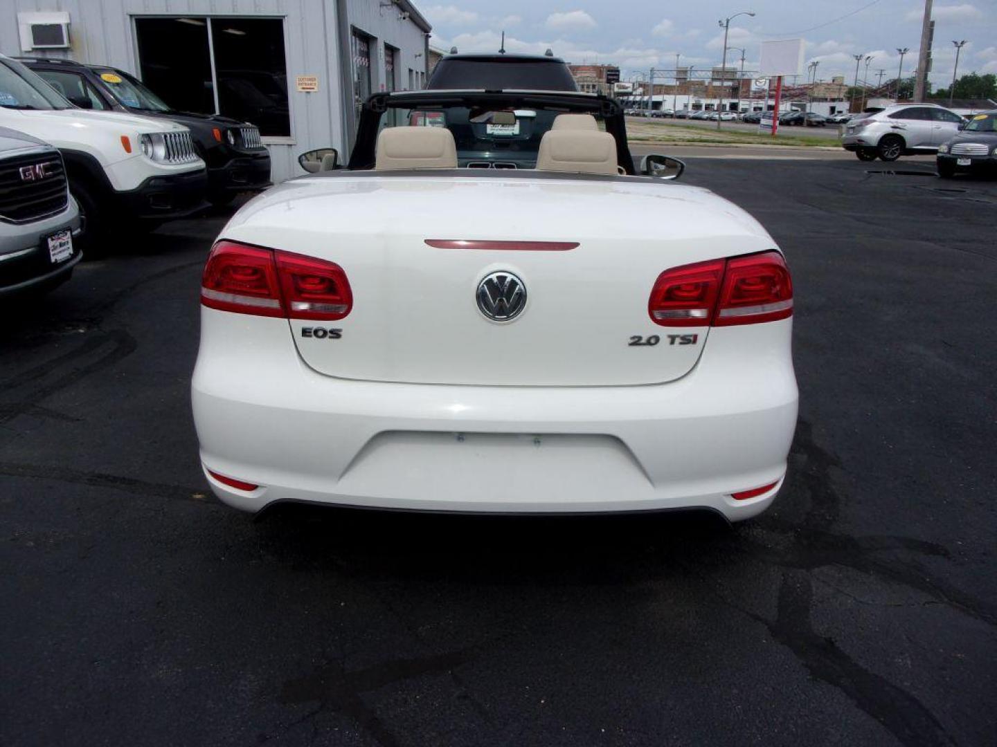 2014 WHITE VOLKSWAGEN EOS KOMFORT (WVWBW8AH5EV) with an 2.0L engine, Automatic transmission, located at 501 E. Columbia St., Springfield, OH, 45503, (800) 262-7122, 39.925262, -83.801796 - ***Clean Carfax***Convertible***EOS Komfort***Heated Leather Seating***Serviced and Detailed*** Jay North Auto has offered hand picked vehicles since 1965! Our customer's enjoy a NO pressure buying experience with a small town feel. All of our vehicles get fully inspected and detailed. We are a - Photo#4