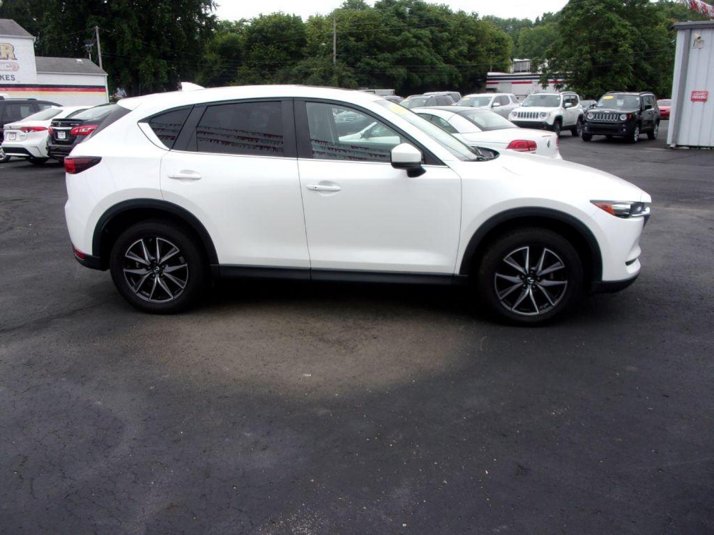 2018 WHITE MAZDA CX-5 TOURING (JM3KFBCM5J0) with an 2.5L engine, Automatic transmission, located at 501 E. Columbia St., Springfield, OH, 45503, (800) 262-7122, 39.925262, -83.801796 - ***LOADED***Heated Seating***TOURING***AWD***Power Liftgate***Moonroof***Serviced and Detailed*** Jay North Auto has offered hand picked vehicles since 1965! Our customer's enjoy a NO pressure buying experience with a small town feel. All of our vehicles get fully inspected and detailed. We are - Photo#0