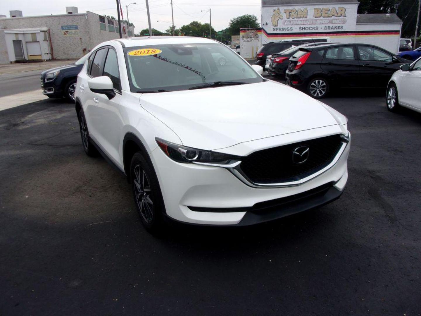 2018 WHITE MAZDA CX-5 TOURING (JM3KFBCM5J0) with an 2.5L engine, Automatic transmission, located at 501 E. Columbia St., Springfield, OH, 45503, (800) 262-7122, 39.925262, -83.801796 - ***LOADED***Heated Seating***TOURING***AWD***Power Liftgate***Moonroof***Serviced and Detailed*** Jay North Auto has offered hand picked vehicles since 1965! Our customer's enjoy a NO pressure buying experience with a small town feel. All of our vehicles get fully inspected and detailed. We are - Photo#2