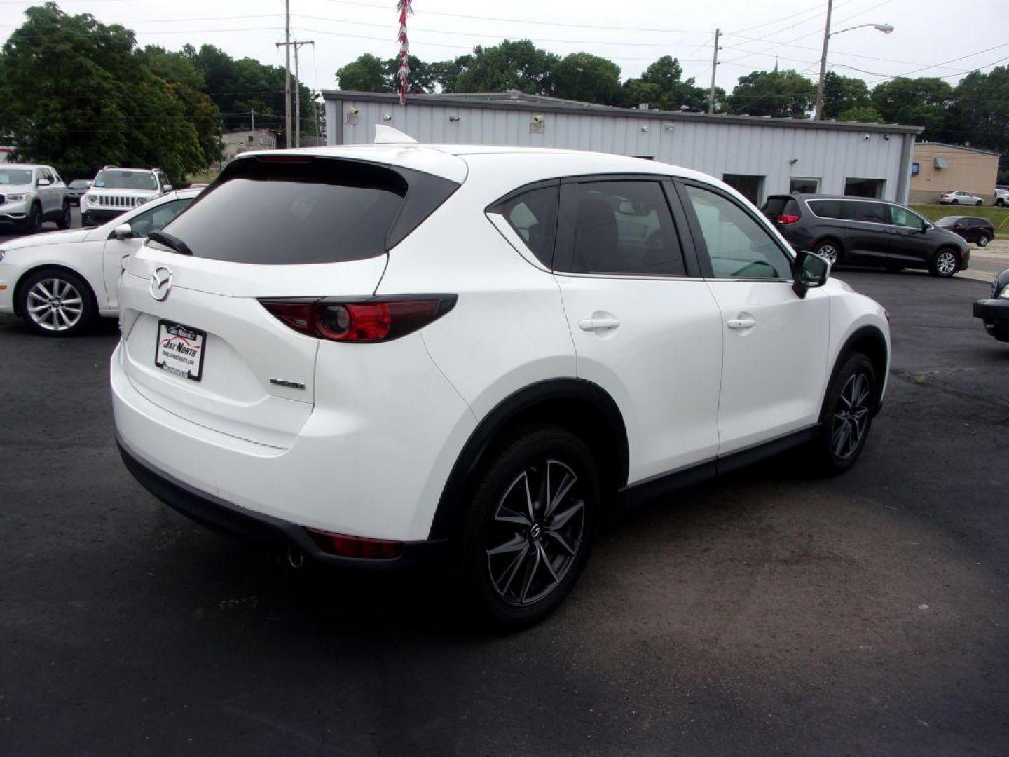 2018 WHITE MAZDA CX-5 TOURING (JM3KFBCM5J0) with an 2.5L engine, Automatic transmission, located at 501 E. Columbia St., Springfield, OH, 45503, (800) 262-7122, 39.925262, -83.801796 - ***LOADED***Heated Seating***TOURING***AWD***Power Liftgate***Moonroof***Serviced and Detailed*** Jay North Auto has offered hand picked vehicles since 1965! Our customer's enjoy a NO pressure buying experience with a small town feel. All of our vehicles get fully inspected and detailed. We are - Photo#3