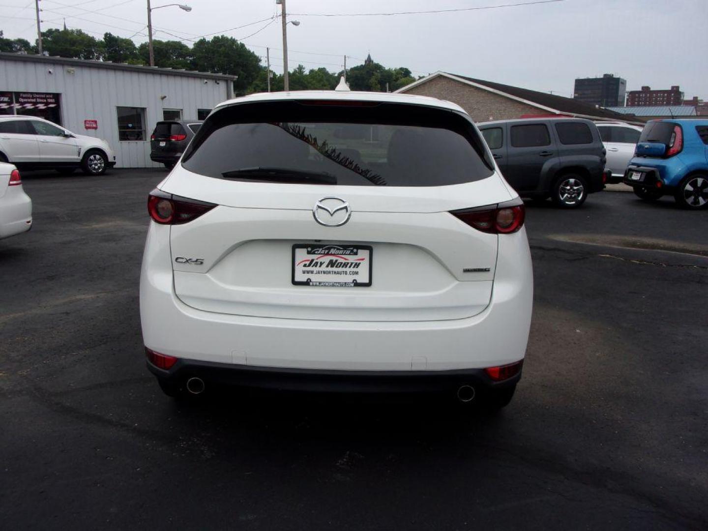 2018 WHITE MAZDA CX-5 TOURING (JM3KFBCM5J0) with an 2.5L engine, Automatic transmission, located at 501 E. Columbia St., Springfield, OH, 45503, (800) 262-7122, 39.925262, -83.801796 - ***LOADED***Heated Seating***TOURING***AWD***Power Liftgate***Moonroof***Serviced and Detailed*** Jay North Auto has offered hand picked vehicles since 1965! Our customer's enjoy a NO pressure buying experience with a small town feel. All of our vehicles get fully inspected and detailed. We are - Photo#4