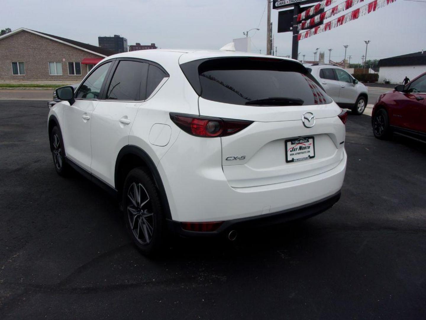 2018 WHITE MAZDA CX-5 TOURING (JM3KFBCM5J0) with an 2.5L engine, Automatic transmission, located at 501 E. Columbia St., Springfield, OH, 45503, (800) 262-7122, 39.925262, -83.801796 - ***LOADED***Heated Seating***TOURING***AWD***Power Liftgate***Moonroof***Serviced and Detailed*** Jay North Auto has offered hand picked vehicles since 1965! Our customer's enjoy a NO pressure buying experience with a small town feel. All of our vehicles get fully inspected and detailed. We are - Photo#5