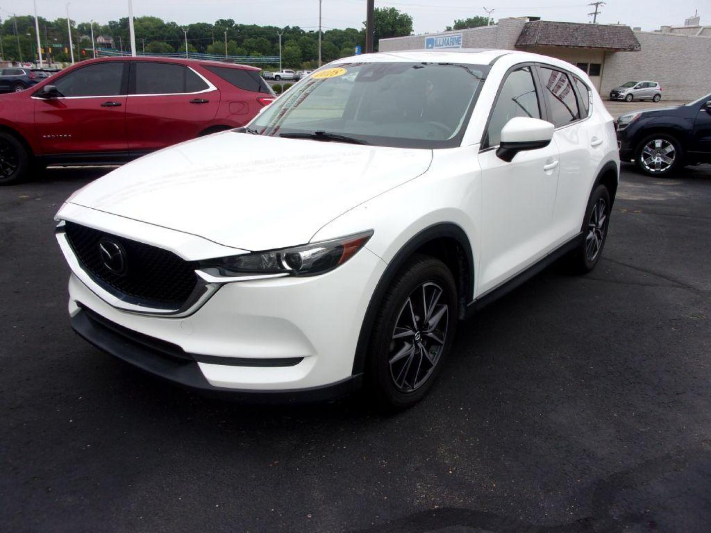 2018 WHITE MAZDA CX-5 TOURING (JM3KFBCM5J0) with an 2.5L engine, Automatic transmission, located at 501 E. Columbia St., Springfield, OH, 45503, (800) 262-7122, 39.925262, -83.801796 - ***LOADED***Heated Seating***TOURING***AWD***Power Liftgate***Moonroof***Serviced and Detailed*** Jay North Auto has offered hand picked vehicles since 1965! Our customer's enjoy a NO pressure buying experience with a small town feel. All of our vehicles get fully inspected and detailed. We are - Photo#6