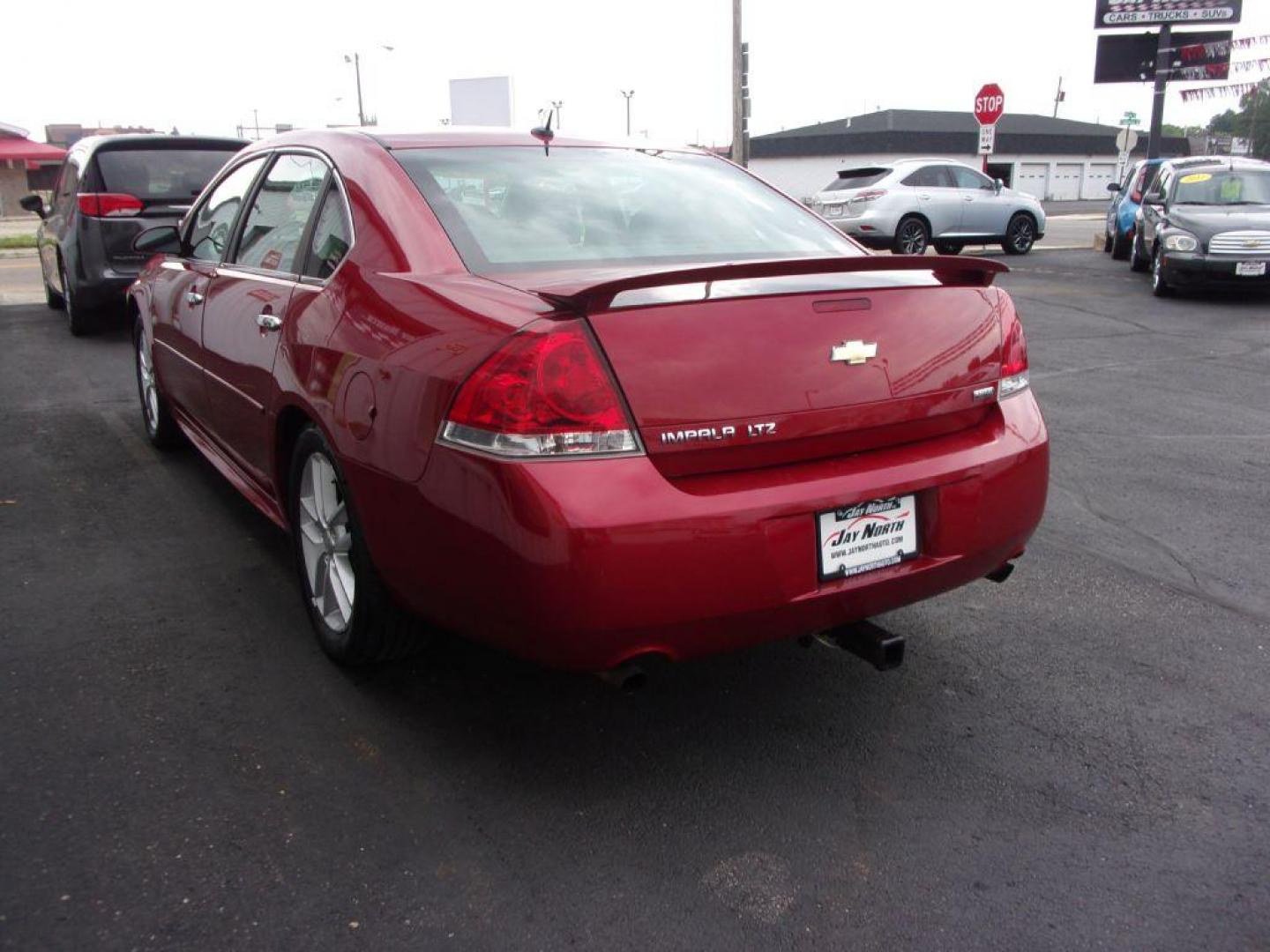 2012 RED CHEVROLET IMPALA LTZ (2G1WC5E38C1) with an 3.6L engine, Automatic transmission, located at 501 E. Columbia St., Springfield, OH, 45503, (800) 262-7122, 39.925262, -83.801796 - ***LOEADED***Heated Leather Seating***LTZ***Moonroof***Remote Start***Serviced and Detailed*** Jay North Auto has offered hand picked vehicles since 1965! Our customer's enjoy a NO pressure buying experience with a small town feel. All of our vehicles get fully inspected and detailed. We are a p - Photo#5