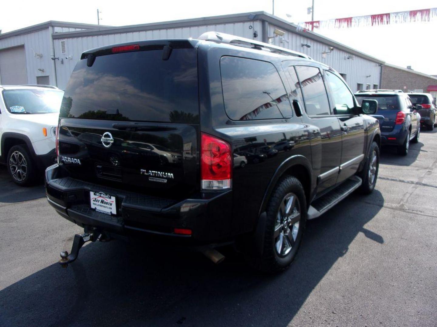 2014 BLACK NISSAN ARMADA PLATINUM RESERVE (5N1BA0NE4EN) with an 5.6L engine, Automatic transmission, located at 501 E. Columbia St., Springfield, OH, 45503, (800) 262-7122, 39.925262, -83.801796 - *** Platinum Reserve *** 4x4 5.6L V8 *** Bose 11 Speaker Audio w/ Navigation *** 2 Row Captain Seating *** Back Up Camera *** 20 inch Black Chrome Wheels *** Serviced and Detailed *** LOADED *** NICE *** DVD *** Jay North Auto has offered hand picked vehicles since 1965! Our customer's enjoy a N - Photo#3