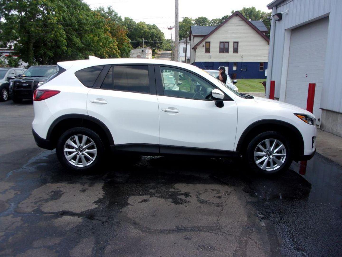 2016 WHITE MAZDA CX-5 TOURING (JM3KE4CY5G0) with an 2.5L engine, Automatic transmission, located at 501 E. Columbia St., Springfield, OH, 45503, (800) 262-7122, 39.925262, -83.801796 - *** New Tires *** Serviced and Detailed *** Moonroof *** Back Up Camera *** Touring *** AWD *** Jay North Auto has offered hand picked vehicles since 1965! Our customer's enjoy a NO pressure buying experience with a small town feel. All of our vehicles get fully inspected and detailed. We are a - Photo#0