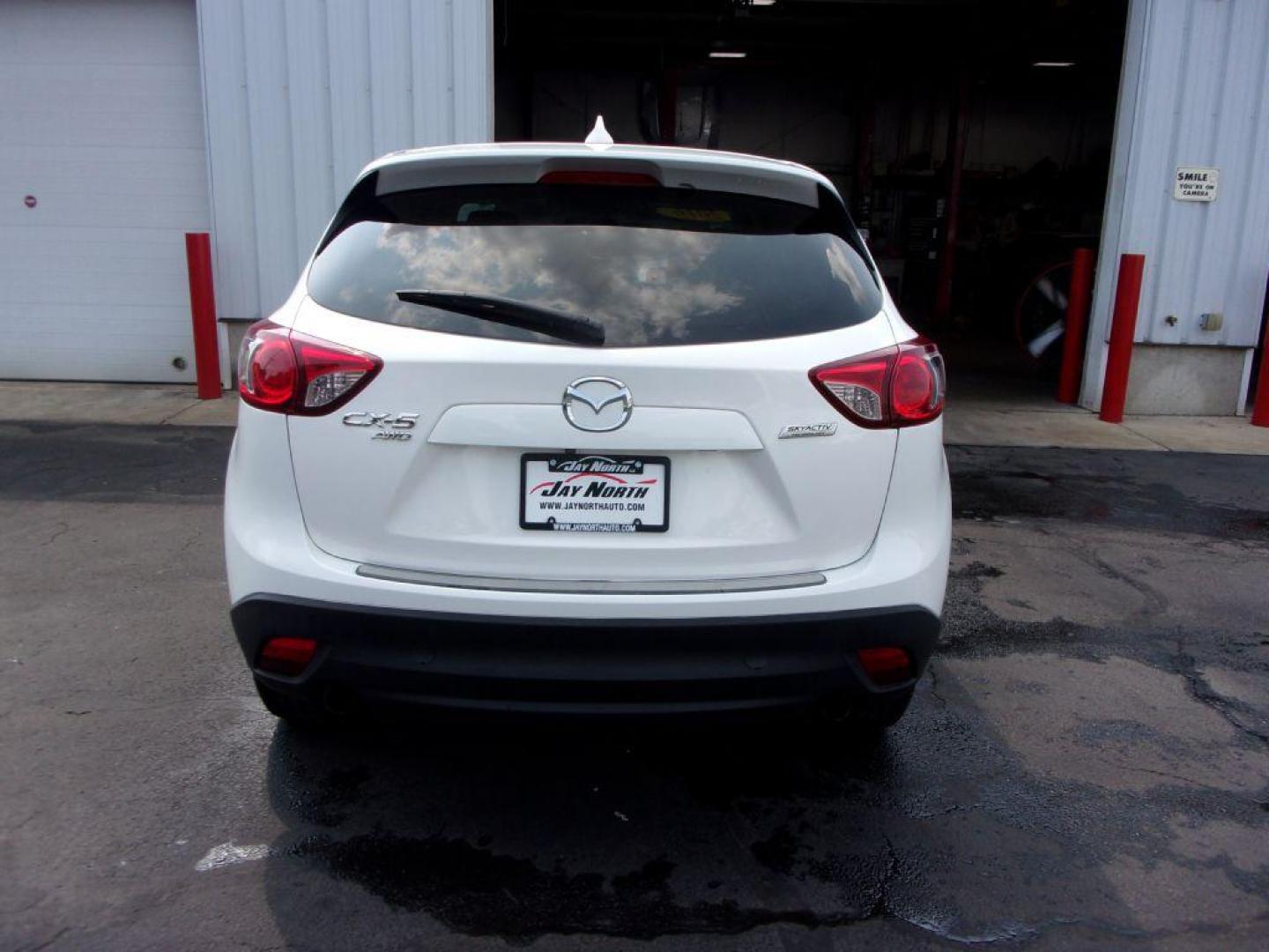 2016 WHITE MAZDA CX-5 TOURING (JM3KE4CY5G0) with an 2.5L engine, Automatic transmission, located at 501 E. Columbia St., Springfield, OH, 45503, (800) 262-7122, 39.925262, -83.801796 - *** New Tires *** Serviced and Detailed *** Moonroof *** Back Up Camera *** Touring *** AWD *** Jay North Auto has offered hand picked vehicles since 1965! Our customer's enjoy a NO pressure buying experience with a small town feel. All of our vehicles get fully inspected and detailed. We are a - Photo#4