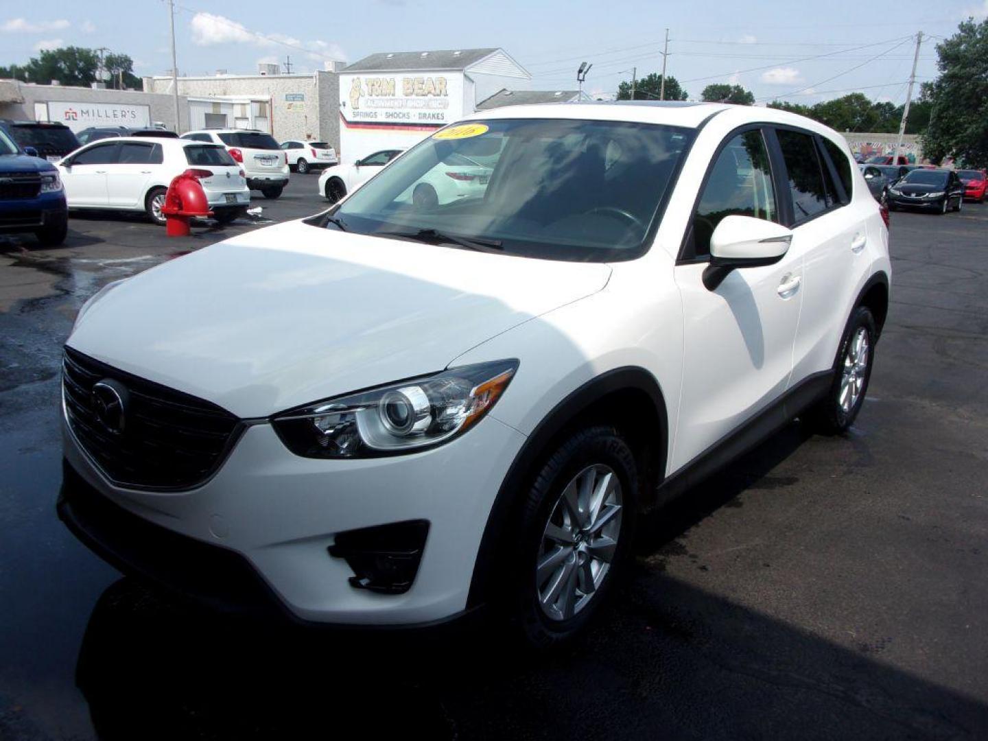 2016 WHITE MAZDA CX-5 TOURING (JM3KE4CY5G0) with an 2.5L engine, Automatic transmission, located at 501 E. Columbia St., Springfield, OH, 45503, (800) 262-7122, 39.925262, -83.801796 - *** New Tires *** Serviced and Detailed *** Moonroof *** Back Up Camera *** Touring *** AWD *** Jay North Auto has offered hand picked vehicles since 1965! Our customer's enjoy a NO pressure buying experience with a small town feel. All of our vehicles get fully inspected and detailed. We are a - Photo#6