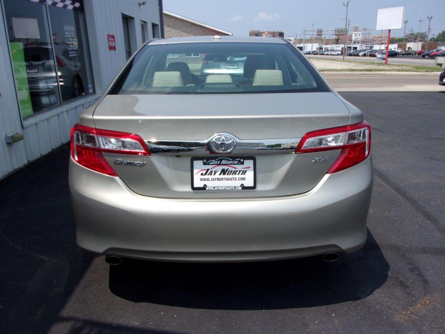 2013 GOLD TOYOTA CAMRY XLE (4T1BK1FK0DU) with an 3.5L engine, Automatic transmission, located at 501 E. Columbia St., Springfield, OH, 45503, (800) 262-7122, 39.925262, -83.801796 - ***XLE***54 Records on Carfax***New Front Pads and Rotors***Heated Leather Seats***Moonroof***Serviced and Detailed*** Jay North Auto has offered hand picked vehicles since 1965! Our customer's enjoy a NO pressure buying experience with a small town feel. All of our vehicles get fully inspected - Photo#4