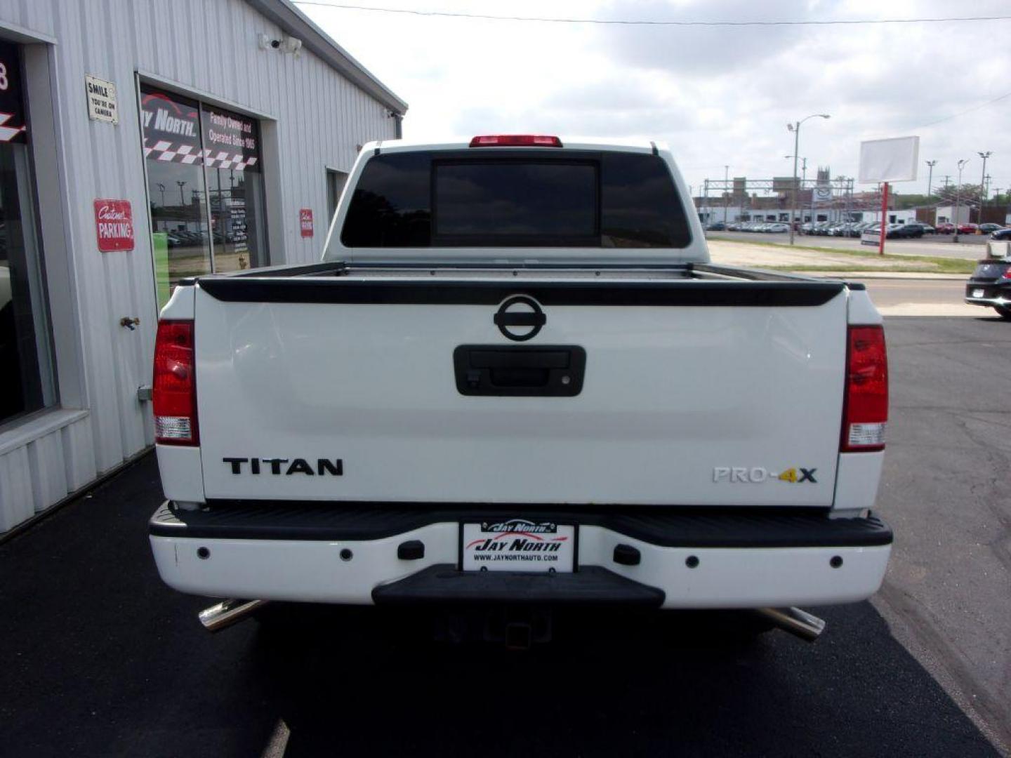 2014 WHITE NISSAN TITAN PRO-4X (1N6AA0EC6EN) with an 5.6L engine, Automatic transmission, located at 501 E. Columbia St., Springfield, OH, 45503, (800) 262-7122, 39.925262, -83.801796 - ***SHARP***New Tires***Rockford Sound System***Pro-4X***Leather Seating***Moonroof***Power Seats***Back-up Camera***LOADED***Serviced and Detailed*** Jay North Auto has offered hand picked vehicles since 1965! Our customer's enjoy a NO pressure buying experience with a small town feel. All of ou - Photo#4