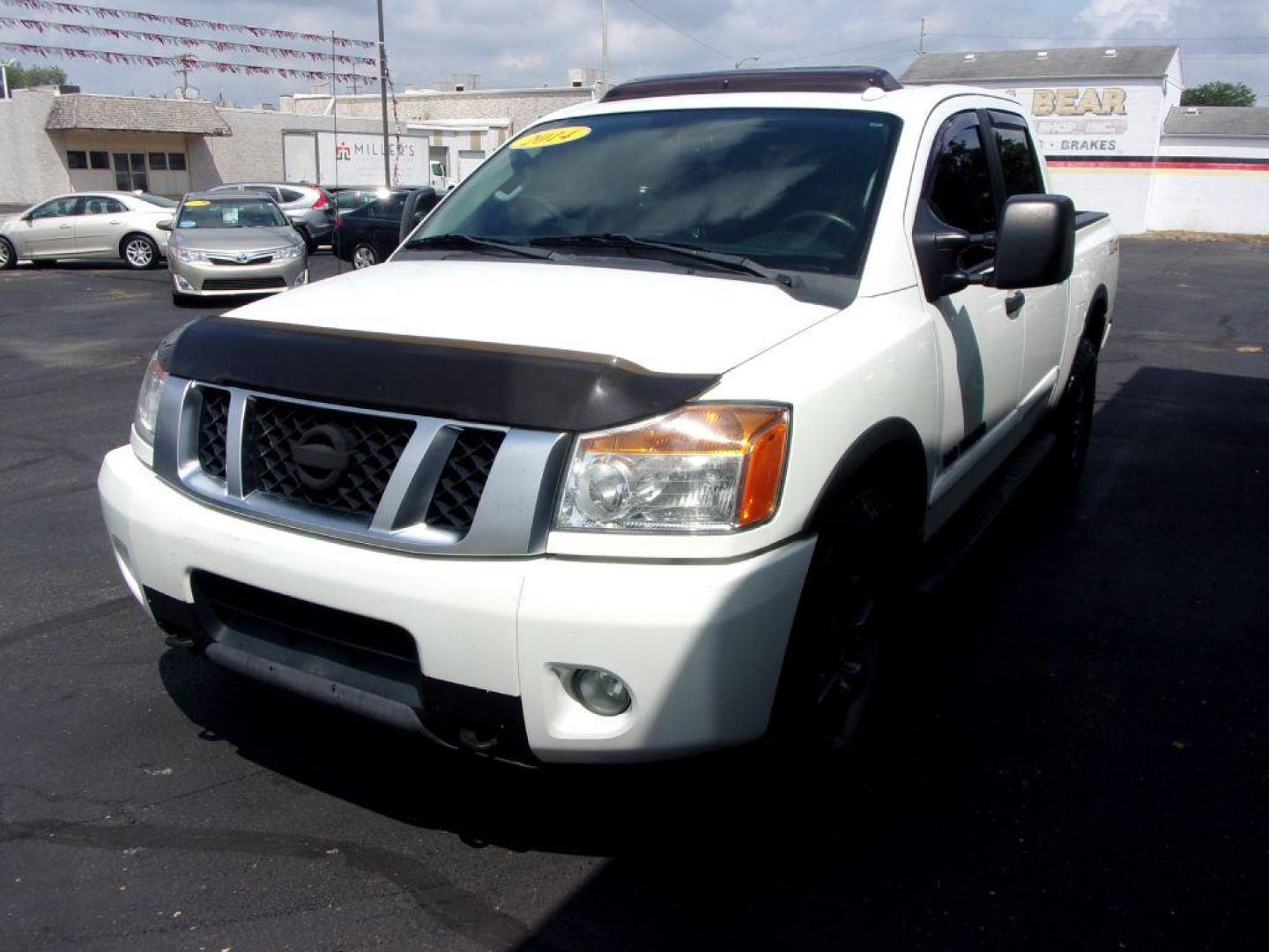 2014 WHITE NISSAN TITAN PRO-4X (1N6AA0EC6EN) with an 5.6L engine, Automatic transmission, located at 501 E. Columbia St., Springfield, OH, 45503, (800) 262-7122, 39.925262, -83.801796 - ***SHARP***New Tires***Rockford Sound System***Pro-4X***Leather Seating***Moonroof***Power Seats***Back-up Camera***LOADED***Serviced and Detailed*** Jay North Auto has offered hand picked vehicles since 1965! Our customer's enjoy a NO pressure buying experience with a small town feel. All of ou - Photo#6