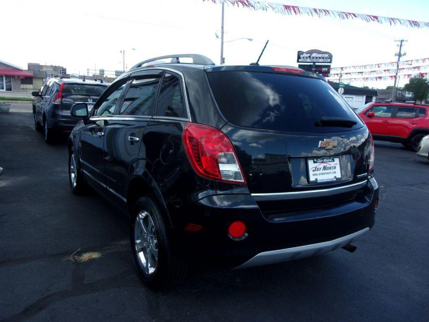 2013 BLACK CHEVROLET CAPTIVA LT (3GNAL3EK4DS) with an 2.4L engine, Automatic transmission, located at 501 E. Columbia St., Springfield, OH, 45503, (800) 262-7122, 39.925262, -83.801796 - ***Clean Carfax***LT***New Tires***Heated Leather Seating***Sunroof***Serviced and Detailed*** Jay North Auto has offered hand picked vehicles since 1965! Our customer's enjoy a NO pressure buying experience with a small town feel. All of our vehicles get fully inspected and detailed. We are a p - Photo#5