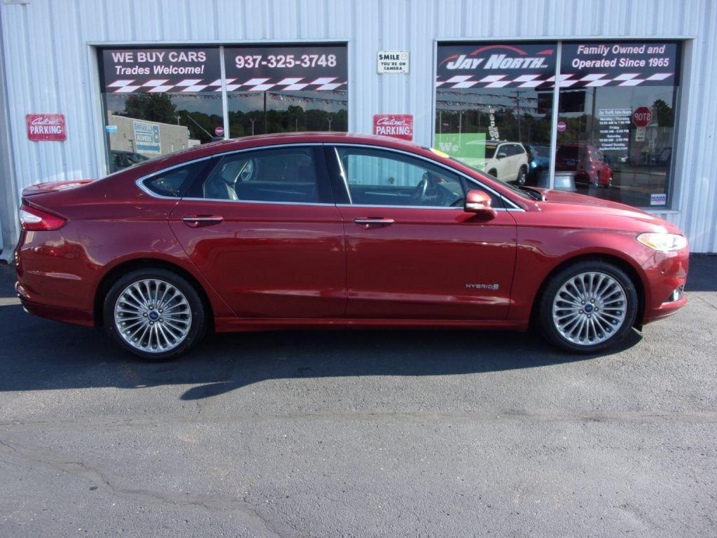 2014 RED FORD FUSION TITANIUM HYBRID (3FA6P0RU3ER) with an 2.0L engine, Continuously Variable transmission, located at 501 E. Columbia St., Springfield, OH, 45503, (800) 262-7122, 39.925262, -83.801796 - Photo#0