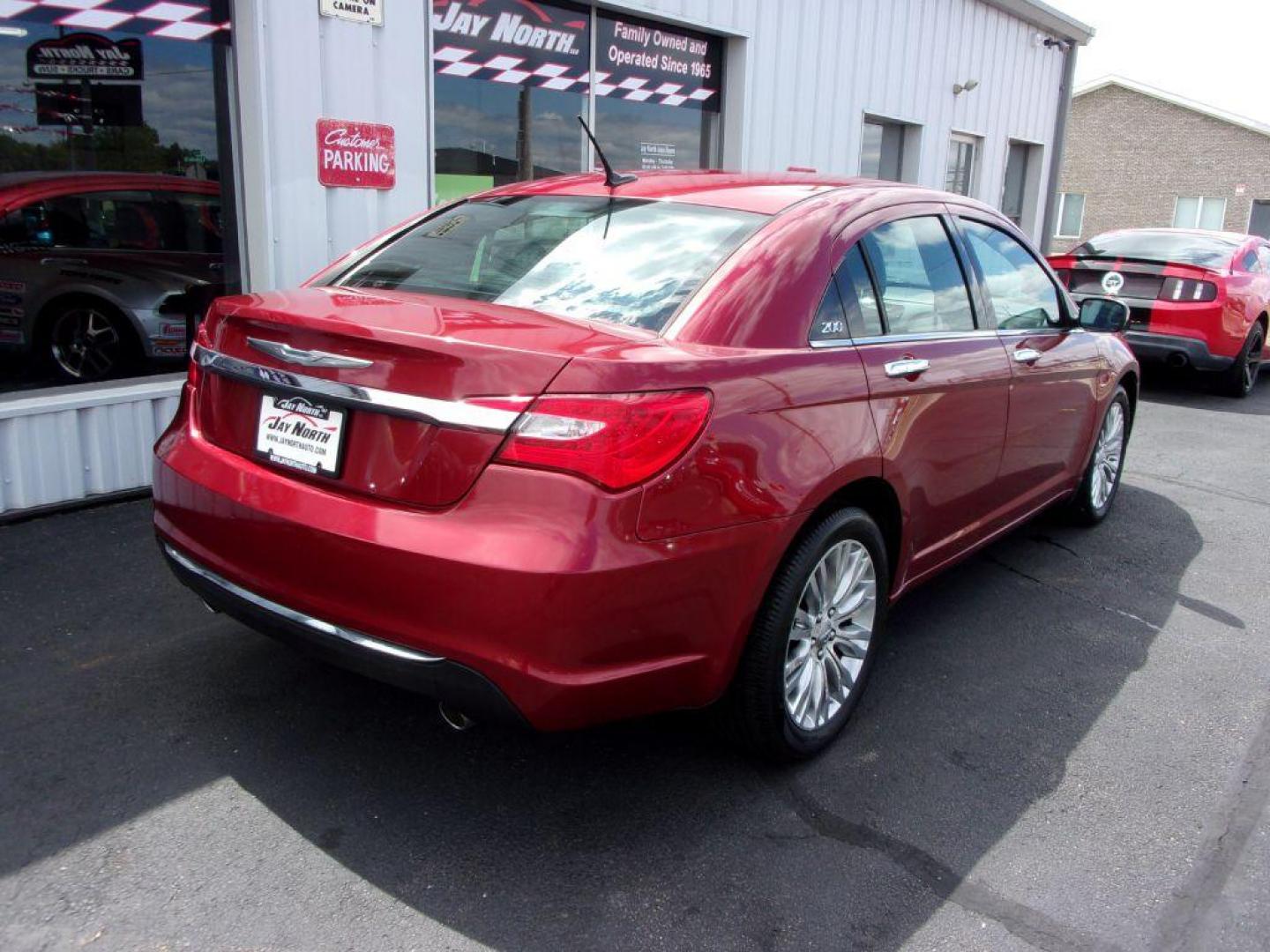 2012 RED CHRYSLER 200 LIMITED (1C3CCBCG1CN) with an 3.6L engine, Automatic transmission, located at 501 E. Columbia St., Springfield, OH, 45503, (800) 262-7122, 39.925262, -83.801796 - *** LOW MILES *** V6 *** Serviced and Detailed *** Moonroof *** Heated Leather Seating *** Premium Audio *** V6 *** Jay North Auto has offered hand picked vehicles since 1965! Our customer's enjoy a NO pressure buying experience with a small town feel. All of our vehicles get fully inspected an - Photo#1