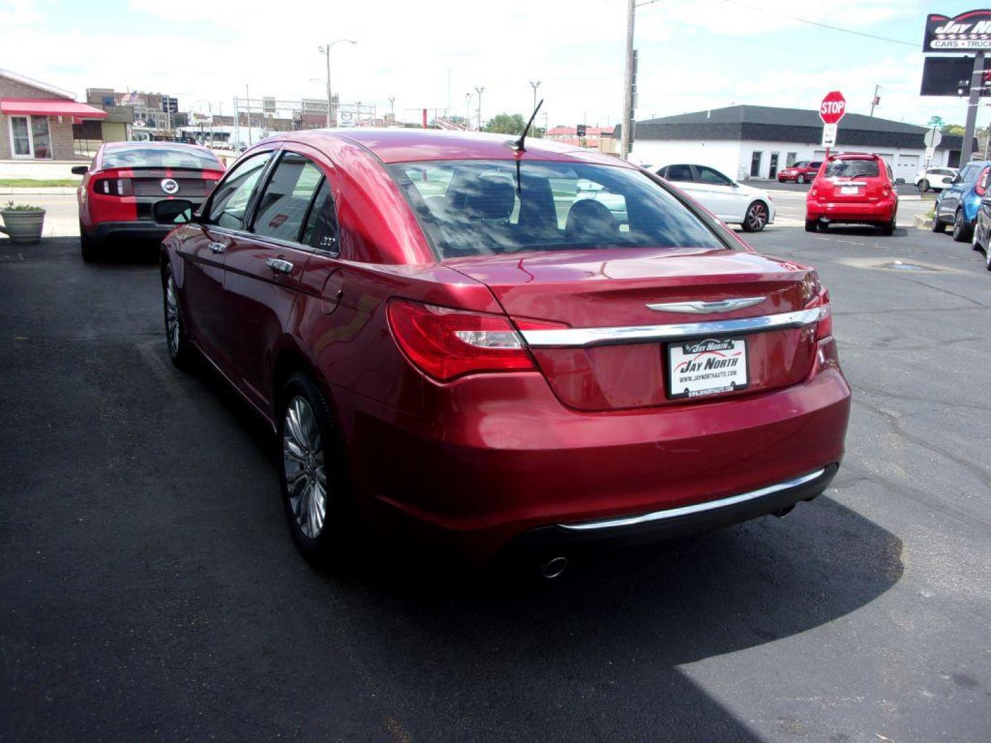 2012 RED CHRYSLER 200 LIMITED (1C3CCBCG1CN) with an 3.6L engine, Automatic transmission, located at 501 E. Columbia St., Springfield, OH, 45503, (800) 262-7122, 39.925262, -83.801796 - *** LOW MILES *** V6 *** Serviced and Detailed *** Moonroof *** Heated Leather Seating *** Premium Audio *** V6 *** Jay North Auto has offered hand picked vehicles since 1965! Our customer's enjoy a NO pressure buying experience with a small town feel. All of our vehicles get fully inspected an - Photo#3