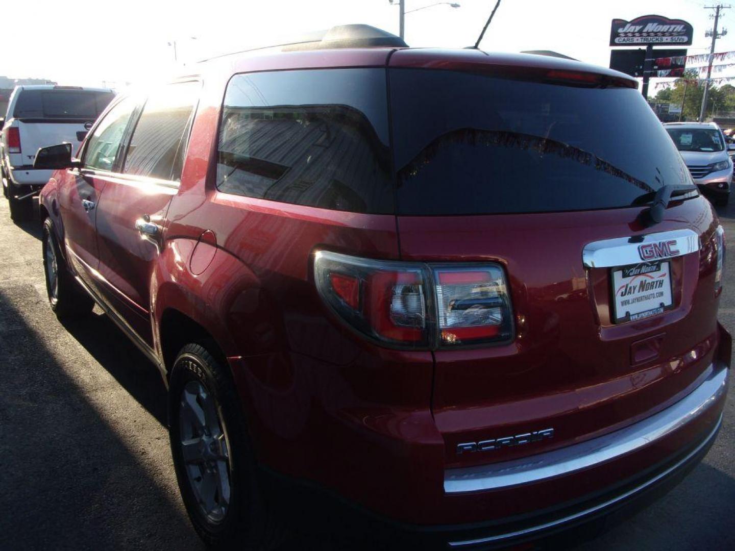 2014 RED GMC ACADIA SLE-2 (1GKKRPKDXEJ) with an 3.6L engine, Automatic transmission, located at 501 E. Columbia St., Springfield, OH, 45503, (800) 262-7122, 39.925262, -83.801796 - *** SLE *** Heated Leather Seating *** V6 *** Panoramic Roof *** Second Row Captain seats *** 3rd Row Seating *** Power Rear Gate *** Remote Start *** FWD *** Serviced and Detailed *** Jay North Auto has offered hand picked vehicles since 1965! Our customer's enjoy a NO pressure buying experienc - Photo#4