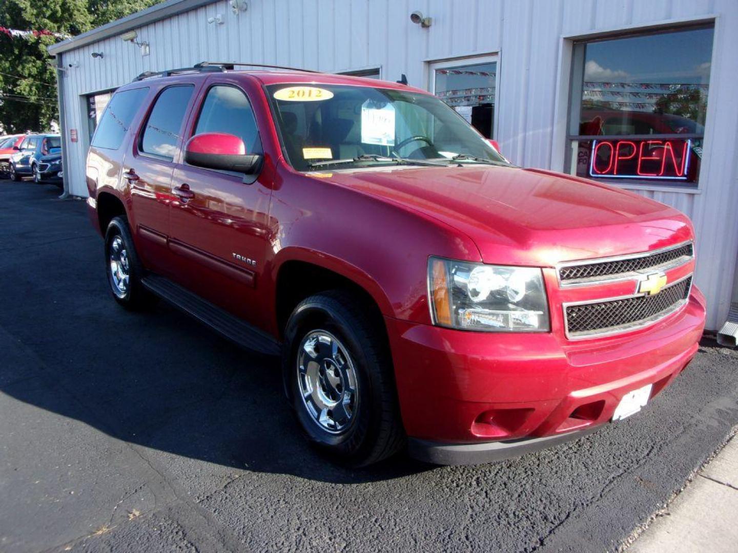 2012 RED CHEVROLET TAHOE 1500 LS (1GNSCAE0XCR) with an 5.3L engine, Automatic transmission, located at 501 E. Columbia St., Springfield, OH, 45503, (800) 262-7122, 39.925262, -83.801796 - *** New Tires *** Serviced and Detailed *** Third Row Seating *** LS *** 5.3L V8 *** 2WD *** NICE!!! *** 2 Owner Clean CarFax *** Jay North Auto has offered hand picked vehicles since 1965! Our customer's enjoy a NO pressure buying experience with a small town feel. All of our vehicles get full - Photo#1