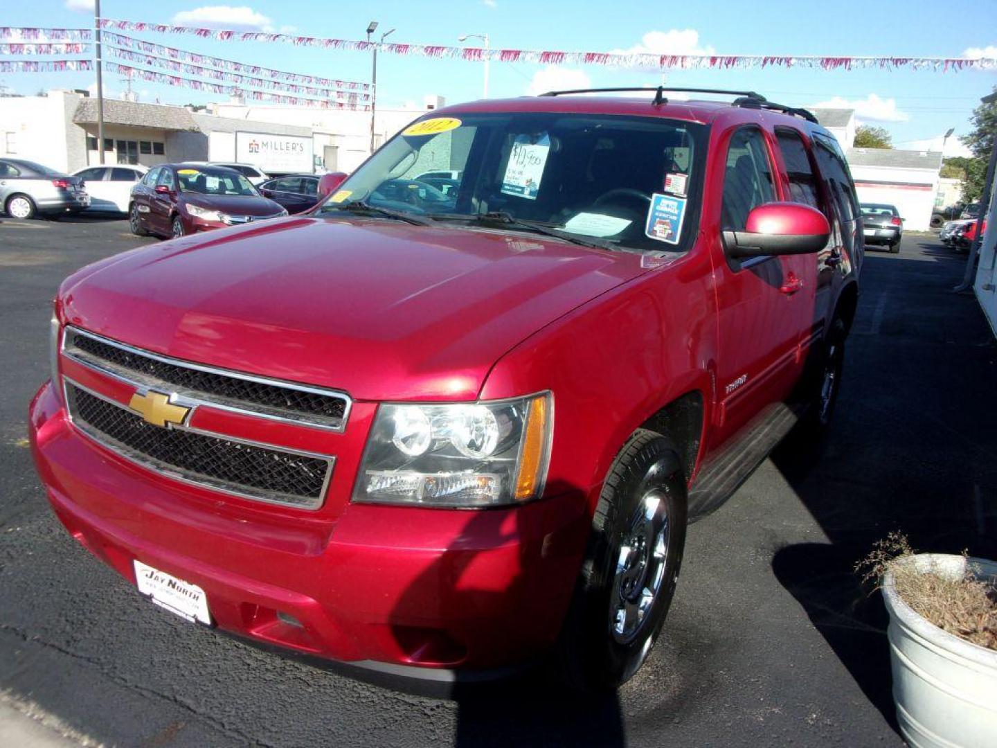 2012 RED CHEVROLET TAHOE 1500 LS (1GNSCAE0XCR) with an 5.3L engine, Automatic transmission, located at 501 E. Columbia St., Springfield, OH, 45503, (800) 262-7122, 39.925262, -83.801796 - *** New Tires *** Serviced and Detailed *** Third Row Seating *** LS *** 5.3L V8 *** 2WD *** NICE!!! *** 2 Owner Clean CarFax *** Jay North Auto has offered hand picked vehicles since 1965! Our customer's enjoy a NO pressure buying experience with a small town feel. All of our vehicles get full - Photo#3