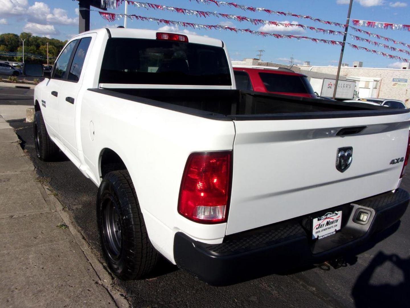 2016 WHITE RAM 1500 TRADESMAN (1C6RR7FG6GS) with an 3.6L engine, Automatic transmission, located at 501 E. Columbia St., Springfield, OH, 45503, (800) 262-7122, 39.925262, -83.801796 - *** New Michelin Tires *** New Wheels *** 2.5 Inch level kit *** Serviced and Detailed *** 4x4 3.6L *** NICE!!! *** 3.55 Rear Axle Ratio Uconnectr 5.0 5.0-Inch Touchscreen Display - Photo#3