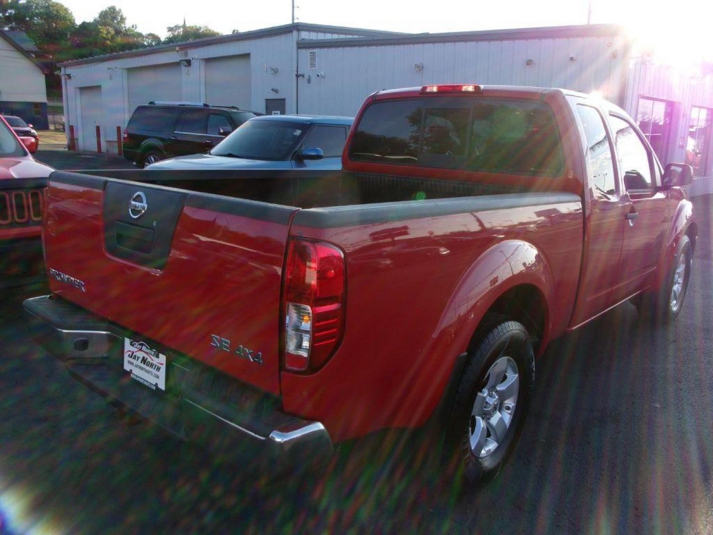 2010 RED NISSAN FRONTIER KING CAB SE (1N6AD0CW1AC) with an 4.0L engine, Automatic transmission, located at 501 E. Columbia St., Springfield, OH, 45503, (800) 262-7122, 39.925262, -83.801796 - *** New Tires *** 4x4 *** Serviced and Detailed *** King Cab *** SE *** 4.0L V6 *** 28 Service Records on Clean CarFax *** Jay North Auto has offered hand picked vehicles since 1965! Our customer's enjoy a NO pressure buying experience with a small town feel. All of our vehicles get fully inspe - Photo#6