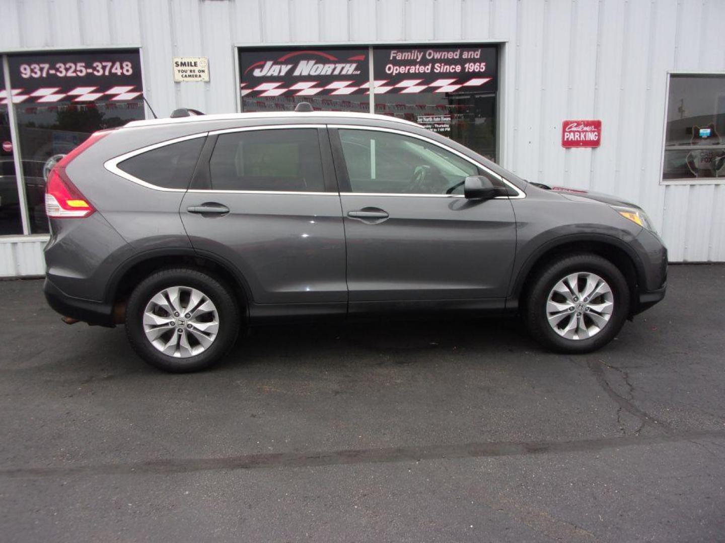 2014 GRAY HONDA CR-V EXL (2HKRM4H7XEH) with an 2.4L engine, Automatic transmission, located at 501 E. Columbia St., Springfield, OH, 45503, (800) 262-7122, 39.925262, -83.801796 - ***Clean Carfax***EXL***Heated Leather Seating***Moonroof***AWD***Serviced and Detailed*** Jay North Auto has offered hand picked vehicles since 1965! Our customer's enjoy a NO pressure buying experience with a small town feel. All of our vehicles get fully inspected and detailed. We are a pre - Photo#0