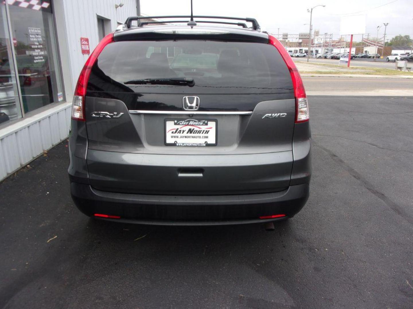 2014 GRAY HONDA CR-V EXL (2HKRM4H7XEH) with an 2.4L engine, Automatic transmission, located at 501 E. Columbia St., Springfield, OH, 45503, (800) 262-7122, 39.925262, -83.801796 - ***Clean Carfax***EXL***Heated Leather Seating***Moonroof***AWD***Serviced and Detailed*** Jay North Auto has offered hand picked vehicles since 1965! Our customer's enjoy a NO pressure buying experience with a small town feel. All of our vehicles get fully inspected and detailed. We are a pre - Photo#4