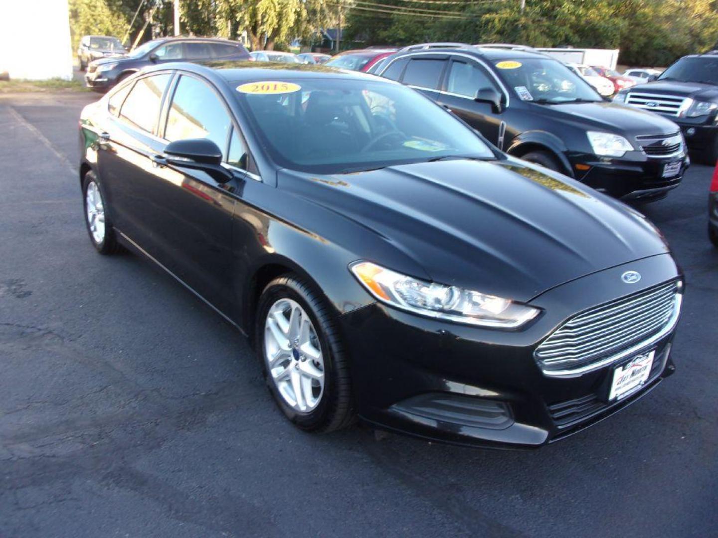 2015 BLACK FORD FUSION SE (1FA6P0H74F5) with an 2.5L engine, Automatic transmission, located at 501 E. Columbia St., Springfield, OH, 45503, (800) 262-7122, 39.925262, -83.801796 - *** 1 Owner Clean CarFax *** 2.5L *** Rear Camera *** Dual Power Seats *** 6 Speaker Premium Audio *** Serviced and Detailed *** Jay North Auto has offered hand picked vehicles since 1965! Our customer's enjoy a NO pressure buying experience with a small town feel. All of our vehicles get fully - Photo#1