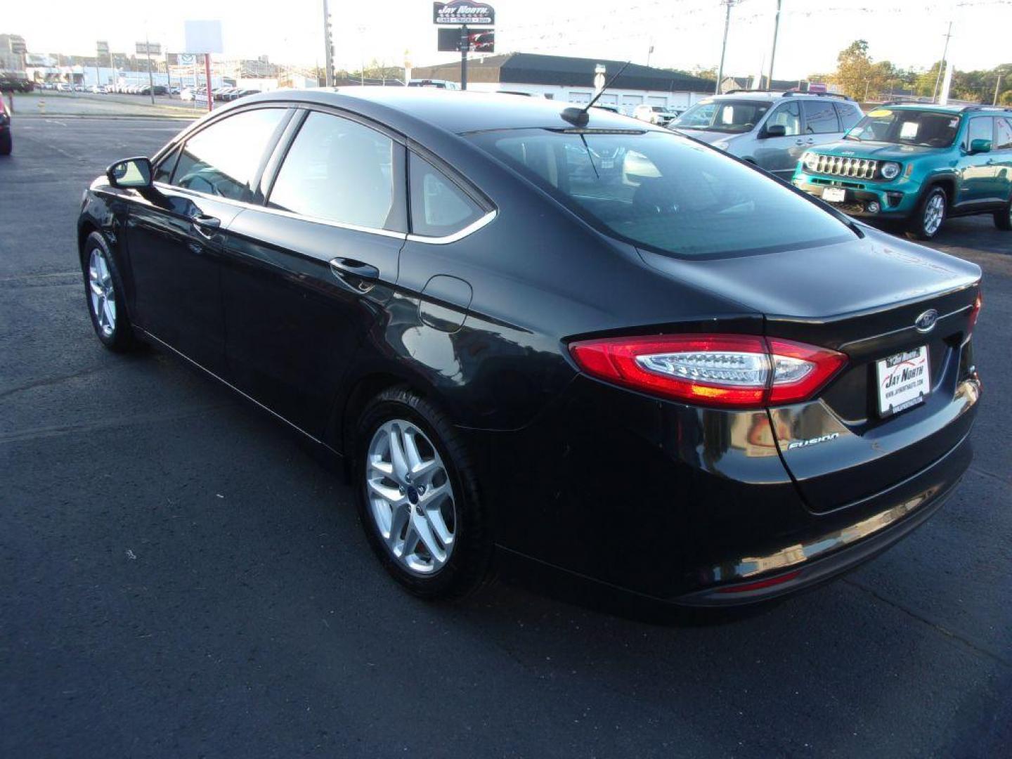 2015 BLACK FORD FUSION SE (1FA6P0H74F5) with an 2.5L engine, Automatic transmission, located at 501 E. Columbia St., Springfield, OH, 45503, (800) 262-7122, 39.925262, -83.801796 - Photo#4