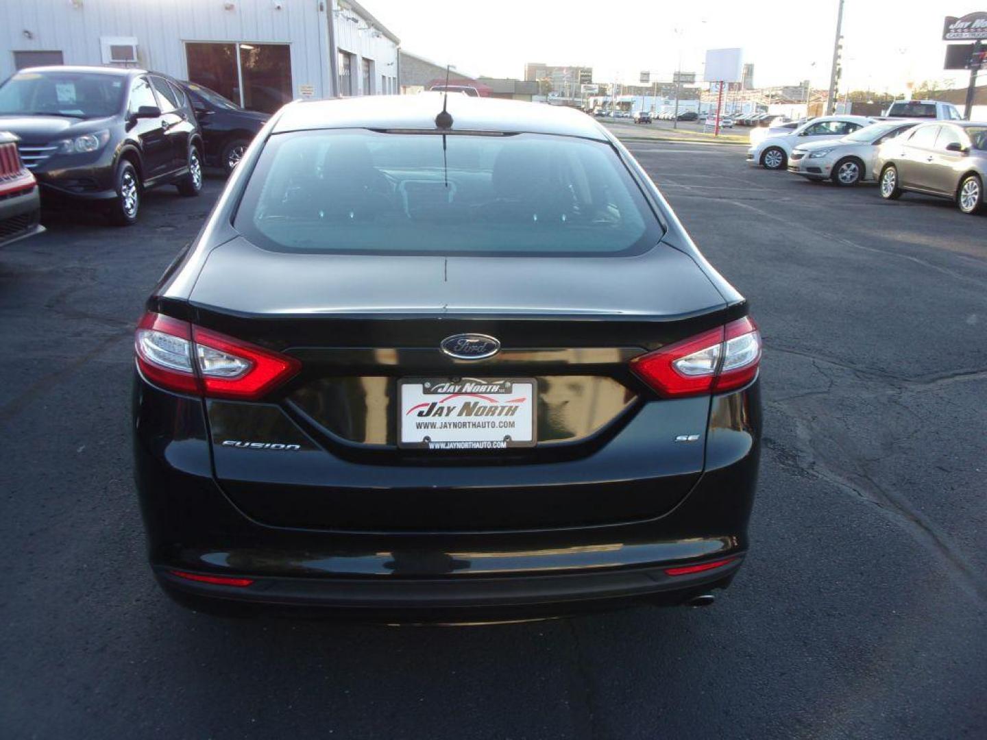 2015 BLACK FORD FUSION SE (1FA6P0H74F5) with an 2.5L engine, Automatic transmission, located at 501 E. Columbia St., Springfield, OH, 45503, (800) 262-7122, 39.925262, -83.801796 - *** 1 Owner Clean CarFax *** 2.5L *** Rear Camera *** Dual Power Seats *** 6 Speaker Premium Audio *** Serviced and Detailed *** Jay North Auto has offered hand picked vehicles since 1965! Our customer's enjoy a NO pressure buying experience with a small town feel. All of our vehicles get fully - Photo#5