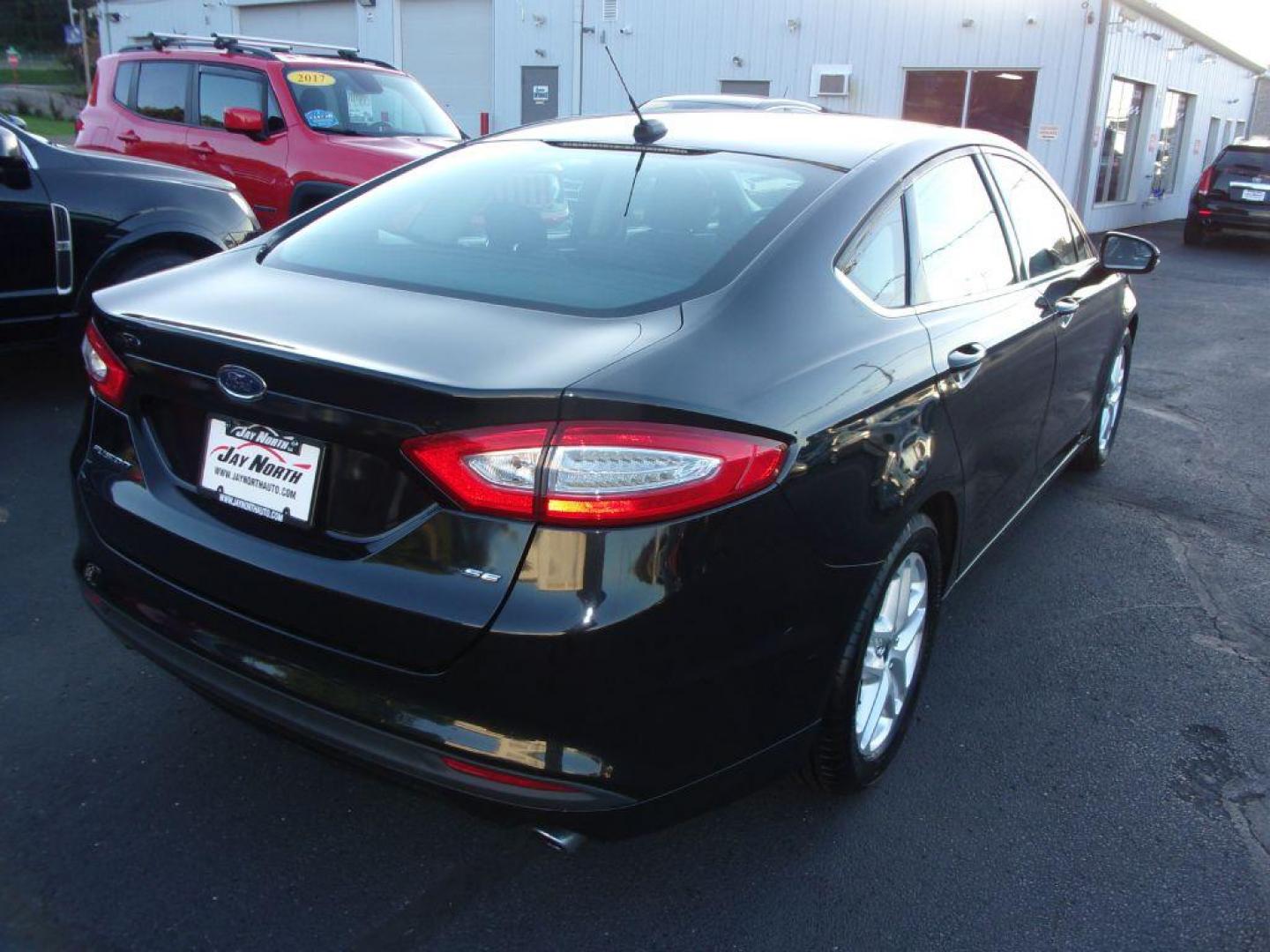 2015 BLACK FORD FUSION SE (1FA6P0H74F5) with an 2.5L engine, Automatic transmission, located at 501 E. Columbia St., Springfield, OH, 45503, (800) 262-7122, 39.925262, -83.801796 - *** 1 Owner Clean CarFax *** 2.5L *** Rear Camera *** Dual Power Seats *** 6 Speaker Premium Audio *** Serviced and Detailed *** Jay North Auto has offered hand picked vehicles since 1965! Our customer's enjoy a NO pressure buying experience with a small town feel. All of our vehicles get fully - Photo#6