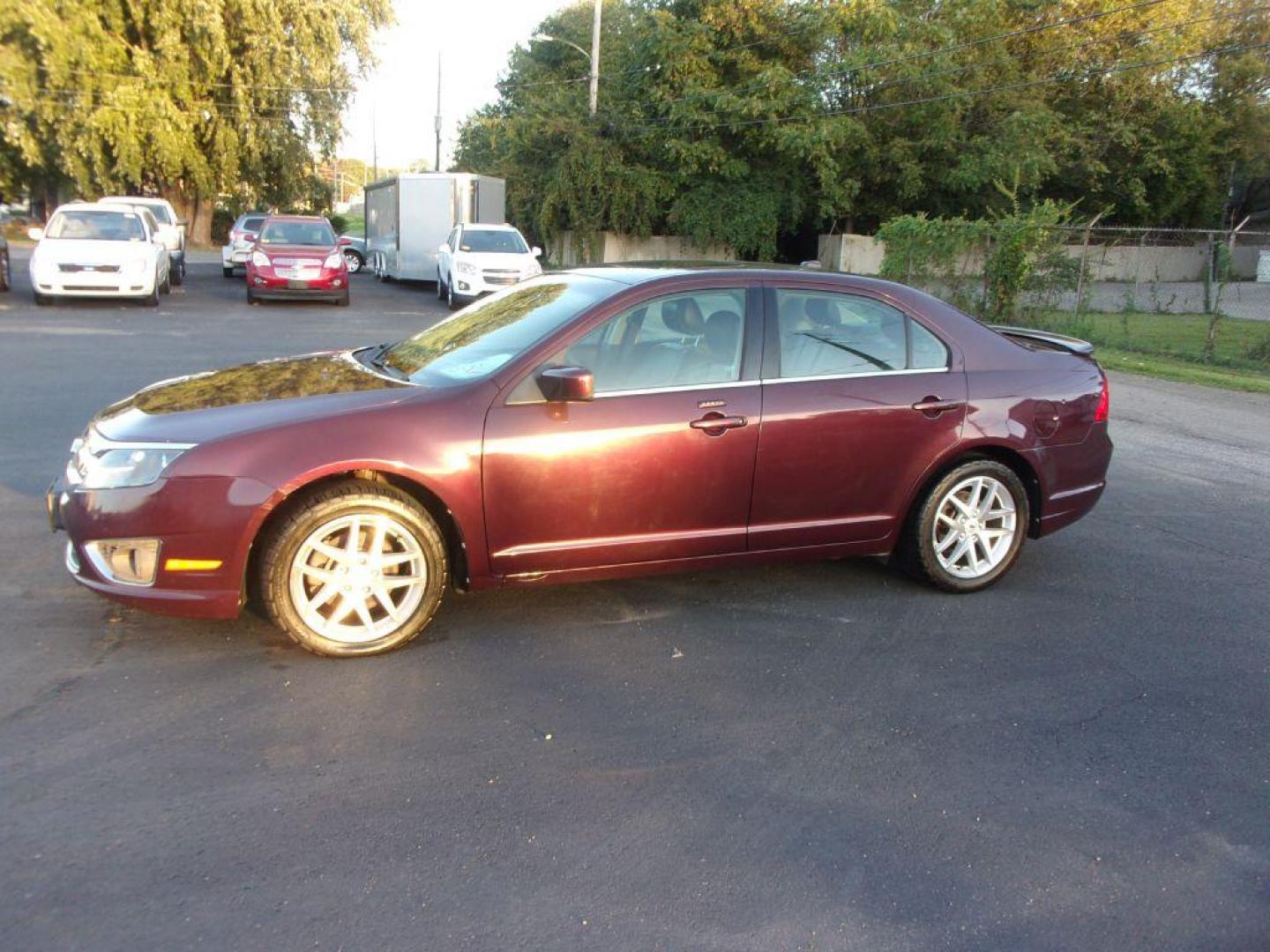 2011 RED FORD FUSION SEL (3FAHP0JG1BR) with an 3.0L engine, Automatic transmission, located at 501 E. Columbia St., Springfield, OH, 45503, (800) 262-7122, 39.925262, -83.801796 - *** Clean CarFax with 28 Service Records *** V6 *** Blind Spot monitoring w/ Cross Traffic alert *** Rear Camera *** Sony Audio w/ 12 Speakers *** Moonroof *** Serviced and Detailed *** Jay North Auto has offered hand picked vehicles since 1965! Our customer's enjoy a NO pressure buying experien - Photo#1