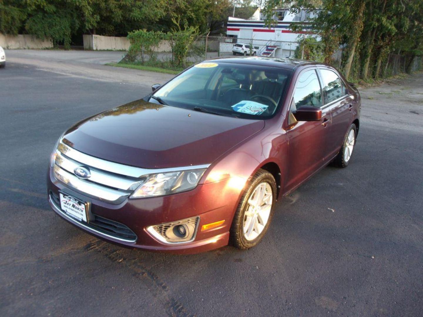 2011 RED FORD FUSION SEL (3FAHP0JG1BR) with an 3.0L engine, Automatic transmission, located at 501 E. Columbia St., Springfield, OH, 45503, (800) 262-7122, 39.925262, -83.801796 - *** Clean CarFax with 28 Service Records *** V6 *** Blind Spot monitoring w/ Cross Traffic alert *** Rear Camera *** Sony Audio w/ 12 Speakers *** Moonroof *** Serviced and Detailed *** Jay North Auto has offered hand picked vehicles since 1965! Our customer's enjoy a NO pressure buying experien - Photo#2