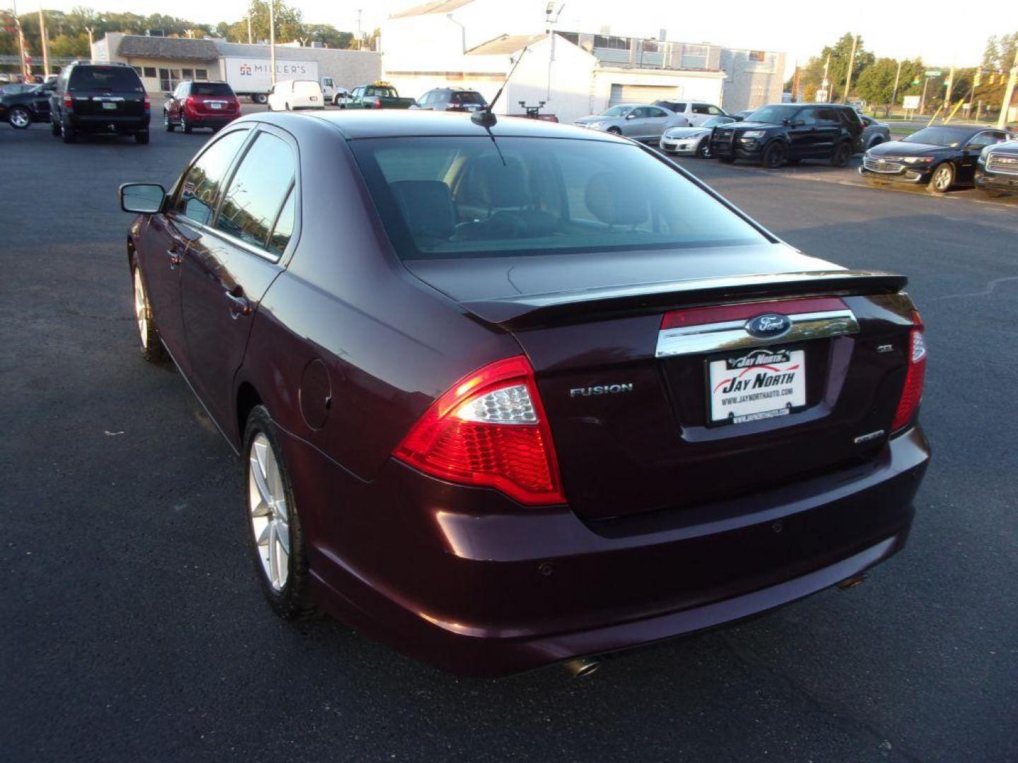 2011 RED FORD FUSION SEL (3FAHP0JG1BR) with an 3.0L engine, Automatic transmission, located at 501 E. Columbia St., Springfield, OH, 45503, (800) 262-7122, 39.925262, -83.801796 - *** Clean CarFax with 28 Service Records *** V6 *** Blind Spot monitoring w/ Cross Traffic alert *** Rear Camera *** Sony Audio w/ 12 Speakers *** Moonroof *** Serviced and Detailed *** Jay North Auto has offered hand picked vehicles since 1965! Our customer's enjoy a NO pressure buying experien - Photo#6