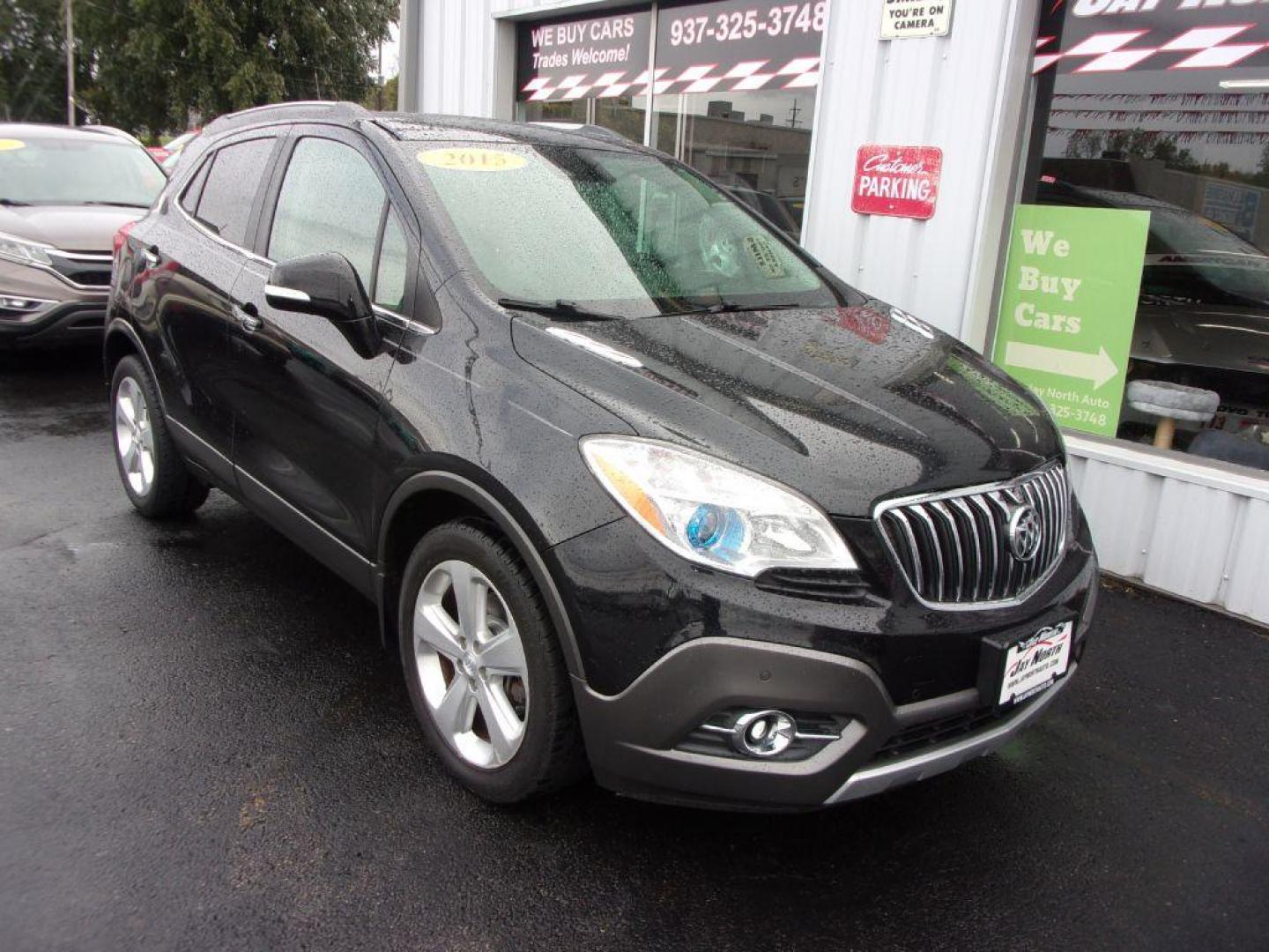 2015 BLACK BUICK ENCORE PREMIUM (KL4CJDSBXFB) with an 1.4L engine, Automatic transmission, located at 501 E. Columbia St., Springfield, OH, 45503, (800) 262-7122, 39.925262, -83.801796 - ***Heated Leather Seating***Heated Steering Wheel***Sunroof***FWD***Serviced and Detailed*** 31 Service Records on CarFax *** Jay North Auto has offered hand picked vehicles since 1965! Our customer's enjoy a NO pressure buying experience with a small town feel. All of our vehicles get fully ins - Photo#1