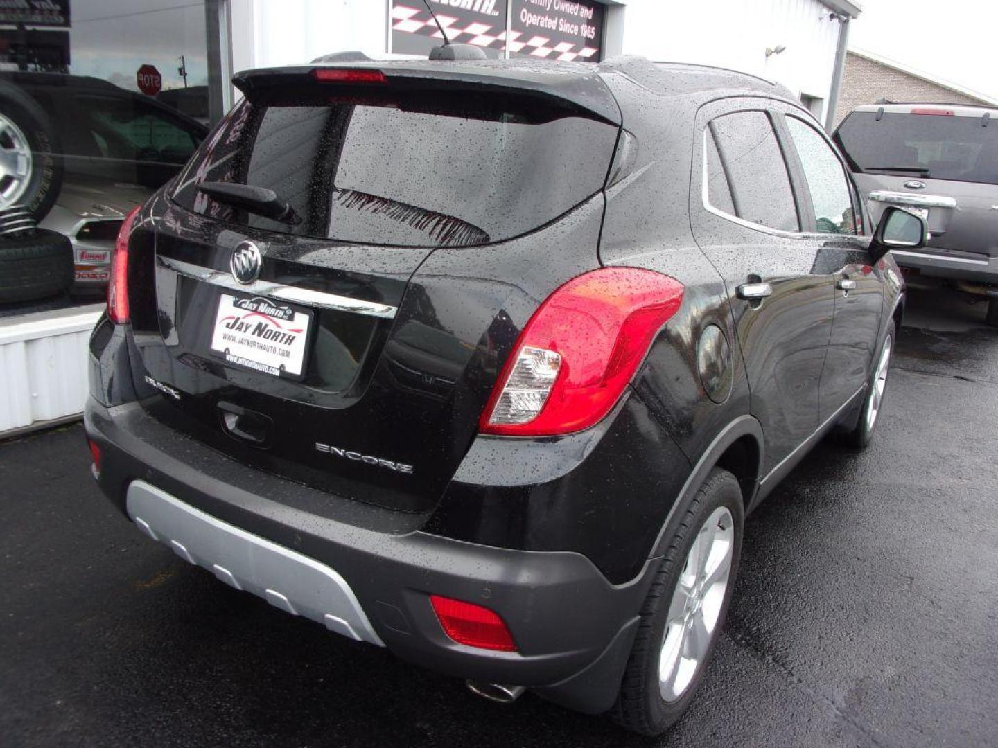 2015 BLACK BUICK ENCORE PREMIUM (KL4CJDSBXFB) with an 1.4L engine, Automatic transmission, located at 501 E. Columbia St., Springfield, OH, 45503, (800) 262-7122, 39.925262, -83.801796 - ***Heated Leather Seating***Heated Steering Wheel***Sunroof***FWD***Serviced and Detailed*** 31 Service Records on CarFax *** Jay North Auto has offered hand picked vehicles since 1965! Our customer's enjoy a NO pressure buying experience with a small town feel. All of our vehicles get fully ins - Photo#4